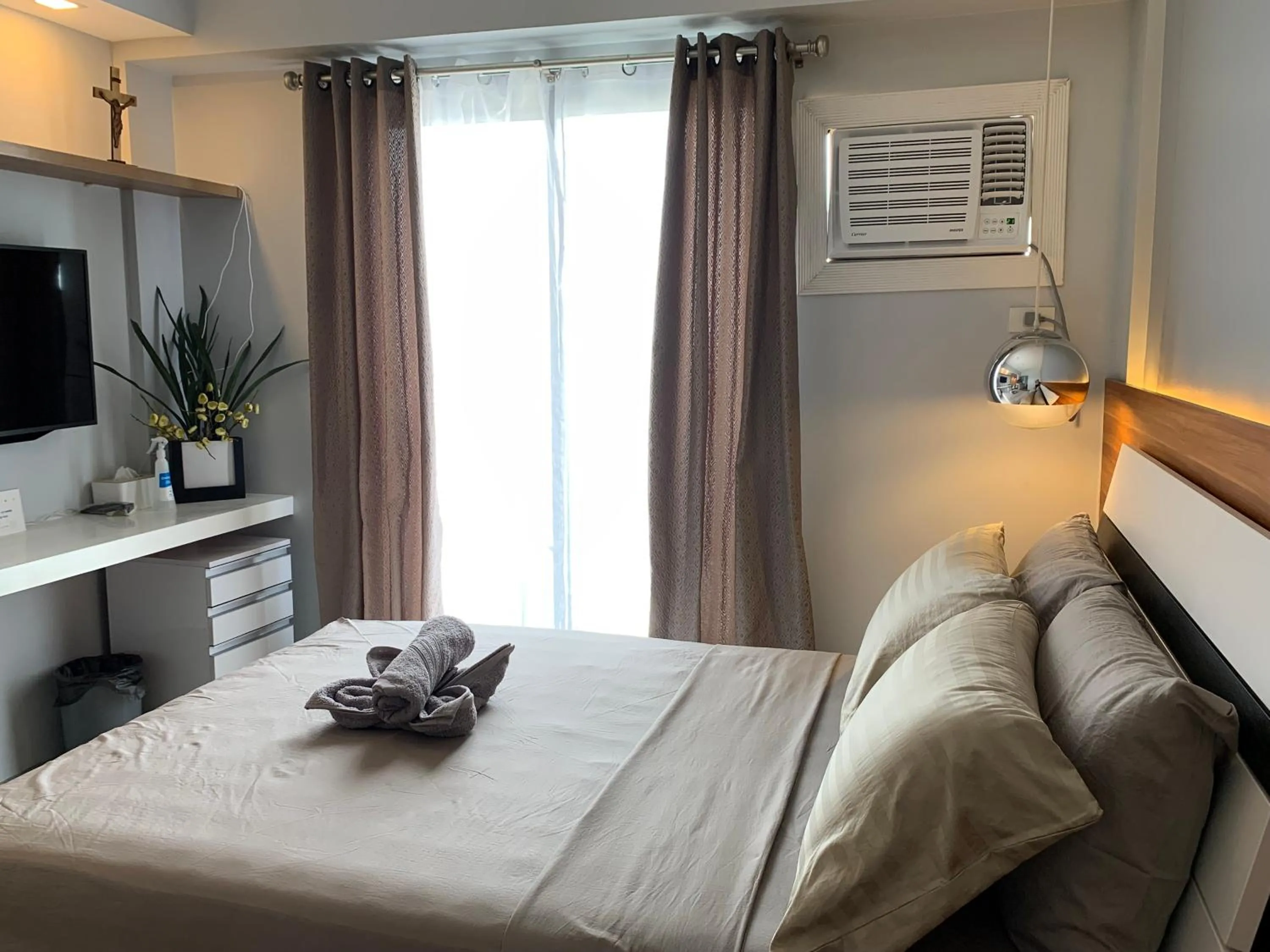 Photo of the whole room, Bed in Neat and Cozy Minimalist Studio