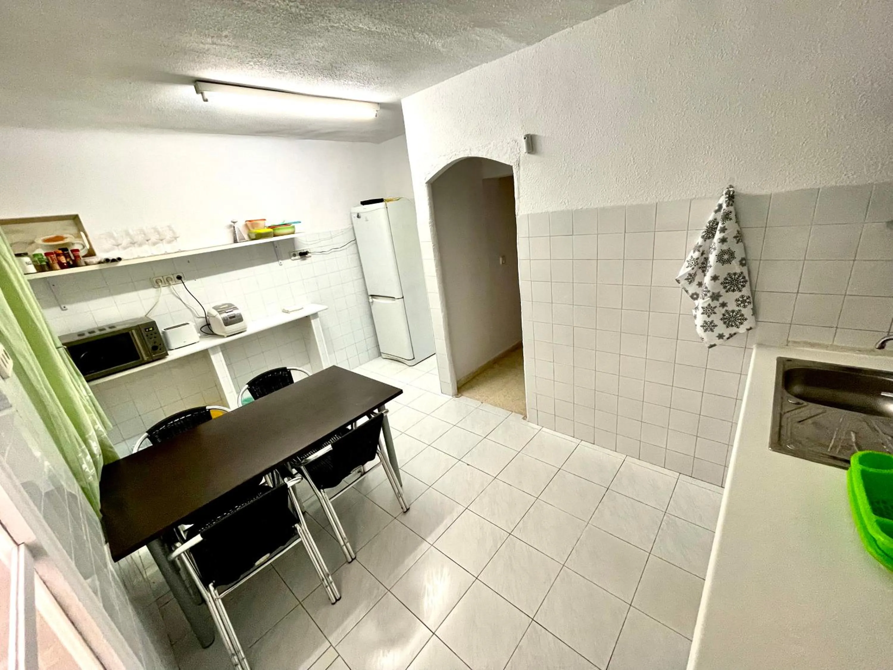 Kitchen or kitchenette in Las habitaciones en Alicante