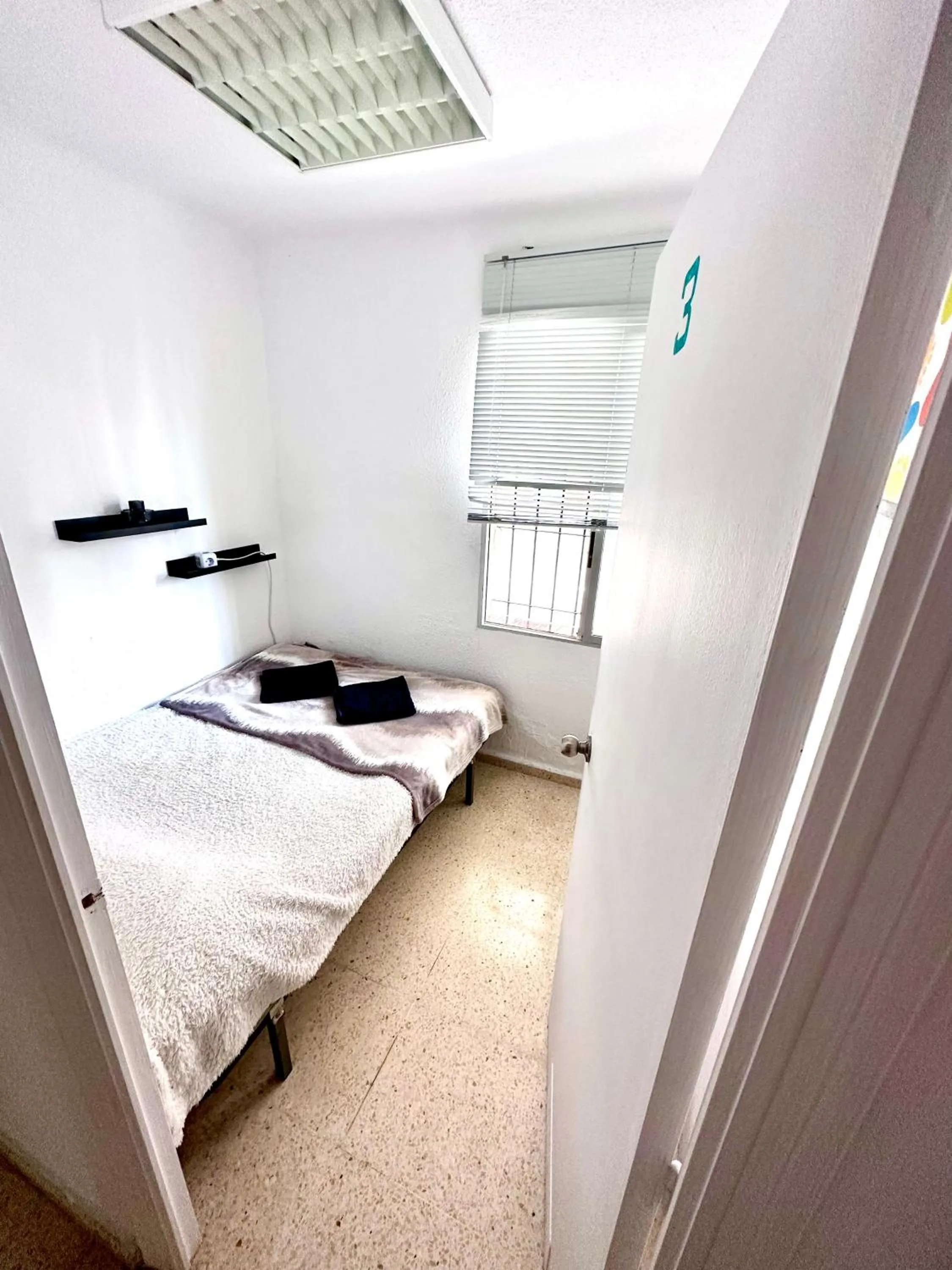 Bed in Las habitaciones en Alicante