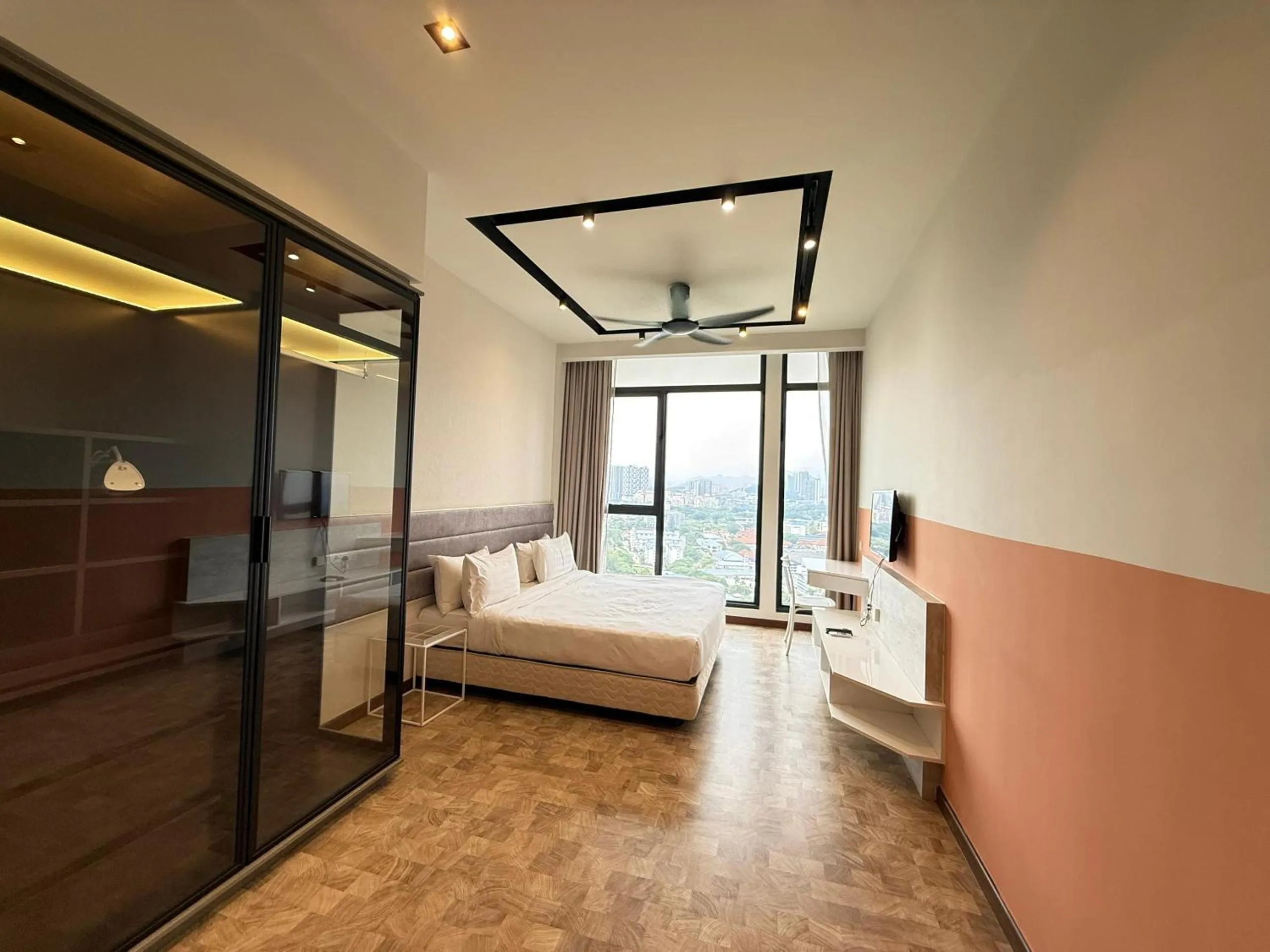 Bed in Expressionz Professional Suites by AURORA SUMMER SUITES