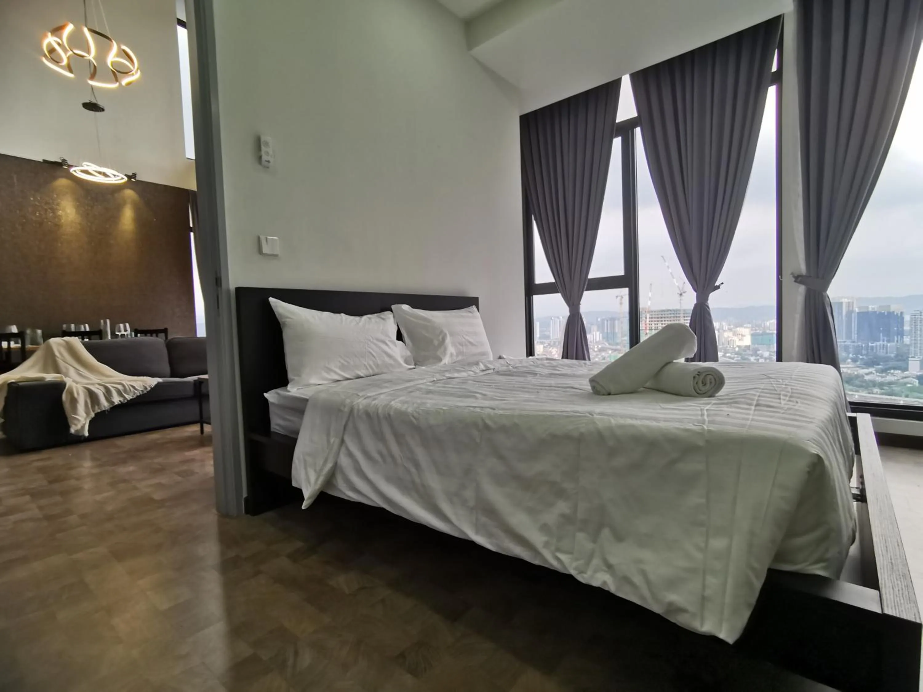 Bed in Expressionz Professional Suites by AURORA SUMMER SUITES