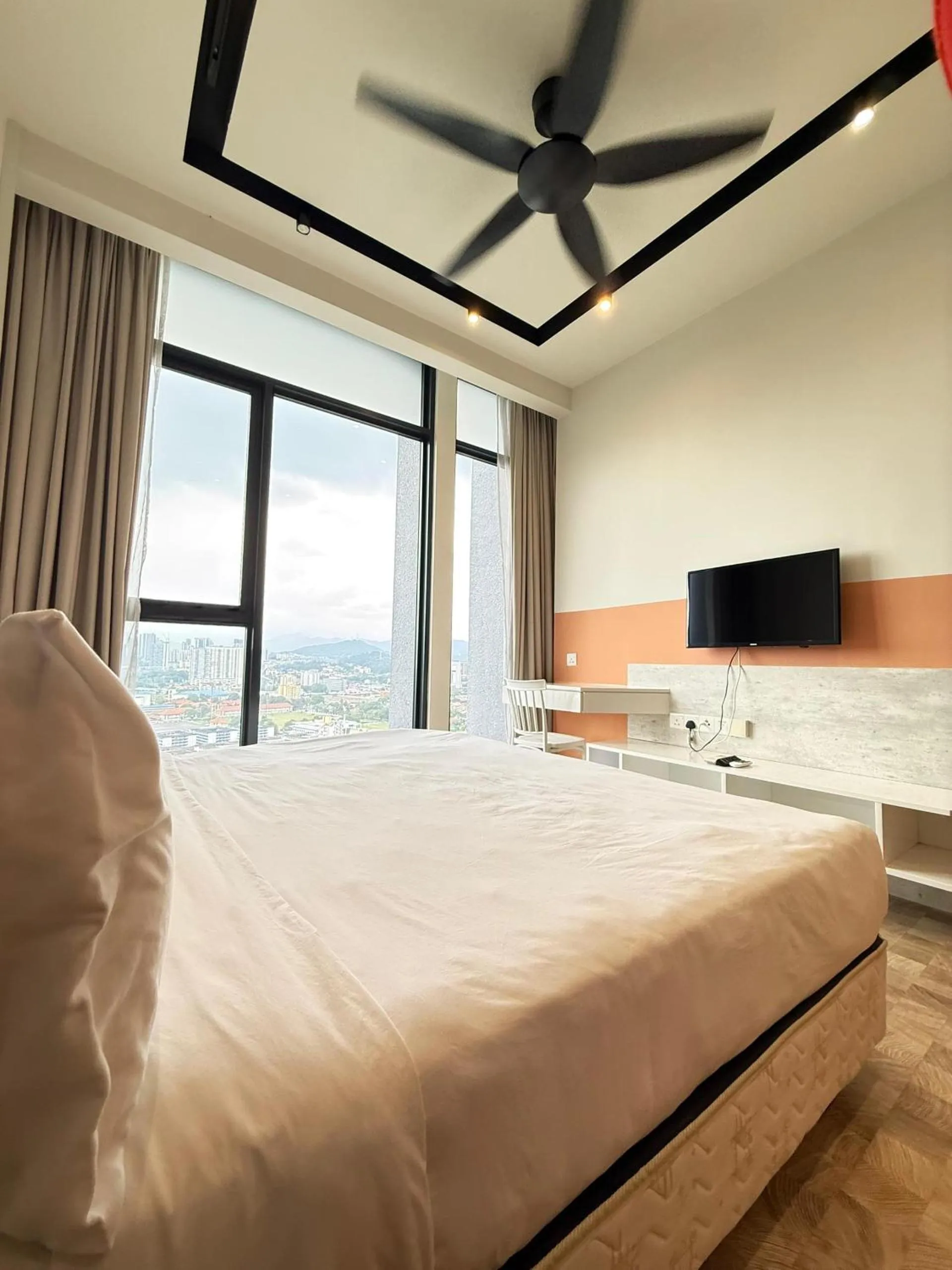 Bed in Expressionz Professional Suites by AURORA SUMMER SUITES