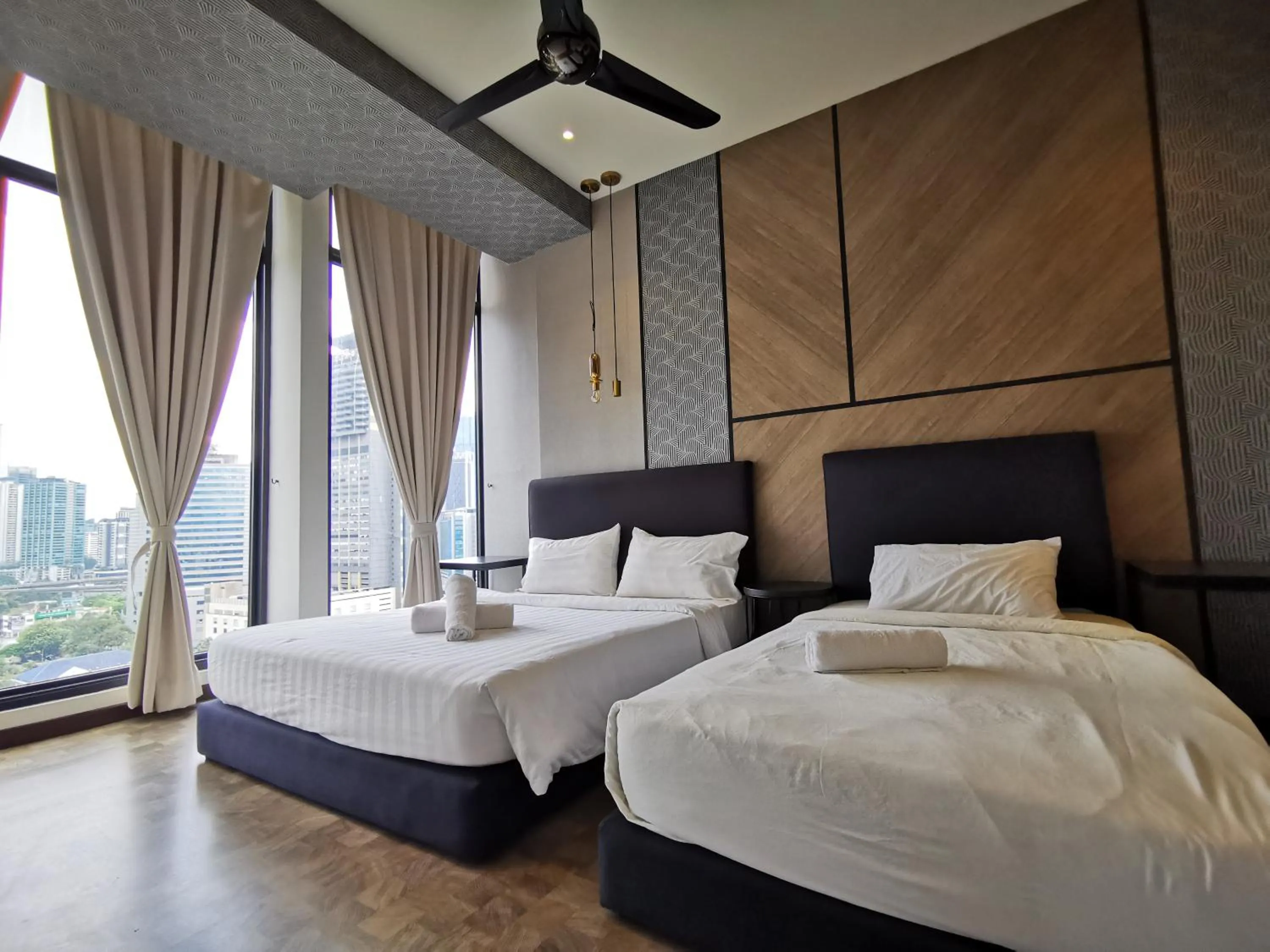 Bed in Expressionz Professional Suites by AURORA SUMMER SUITES