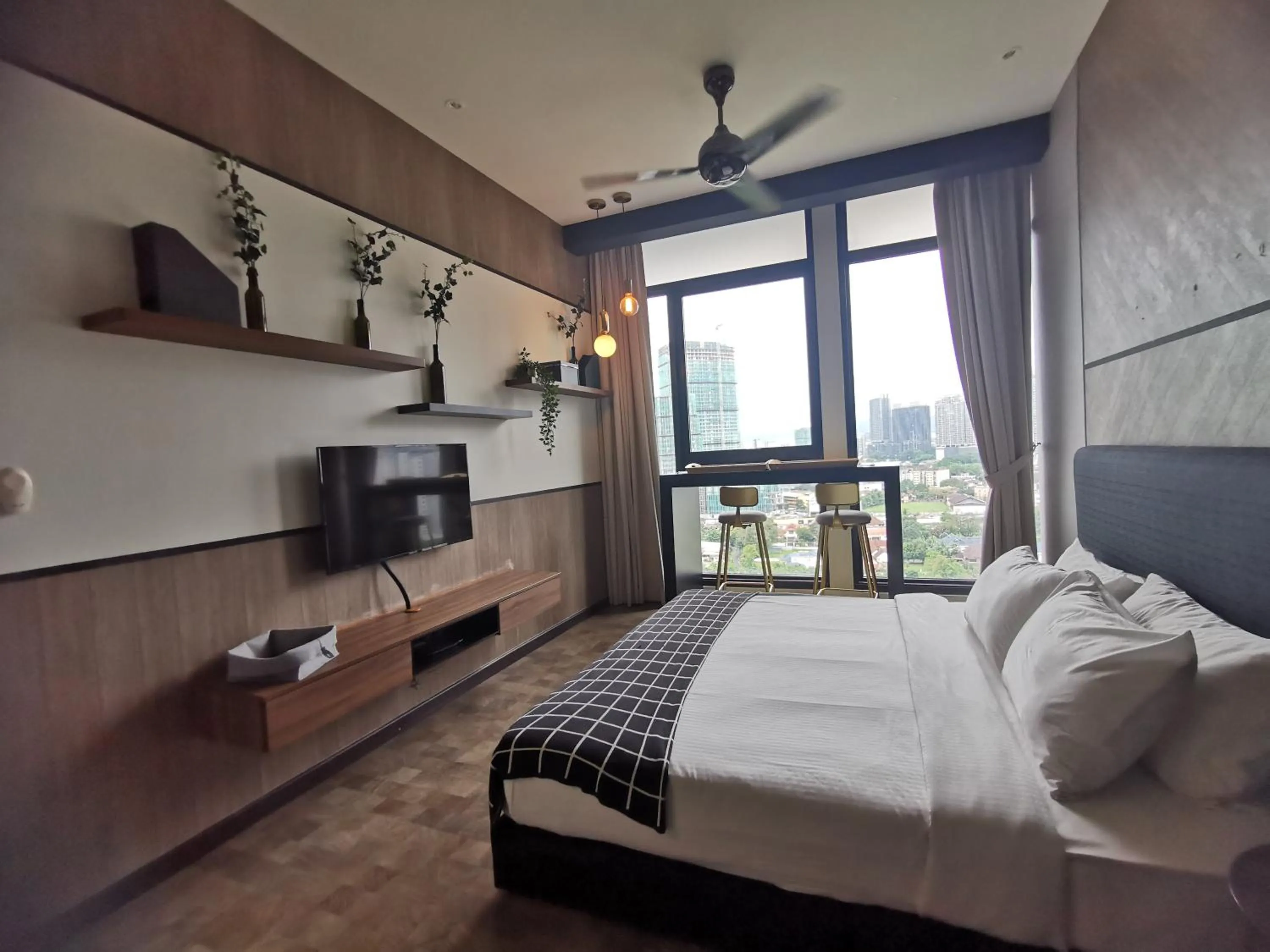 Bed in Expressionz Professional Suites by AURORA SUMMER SUITES