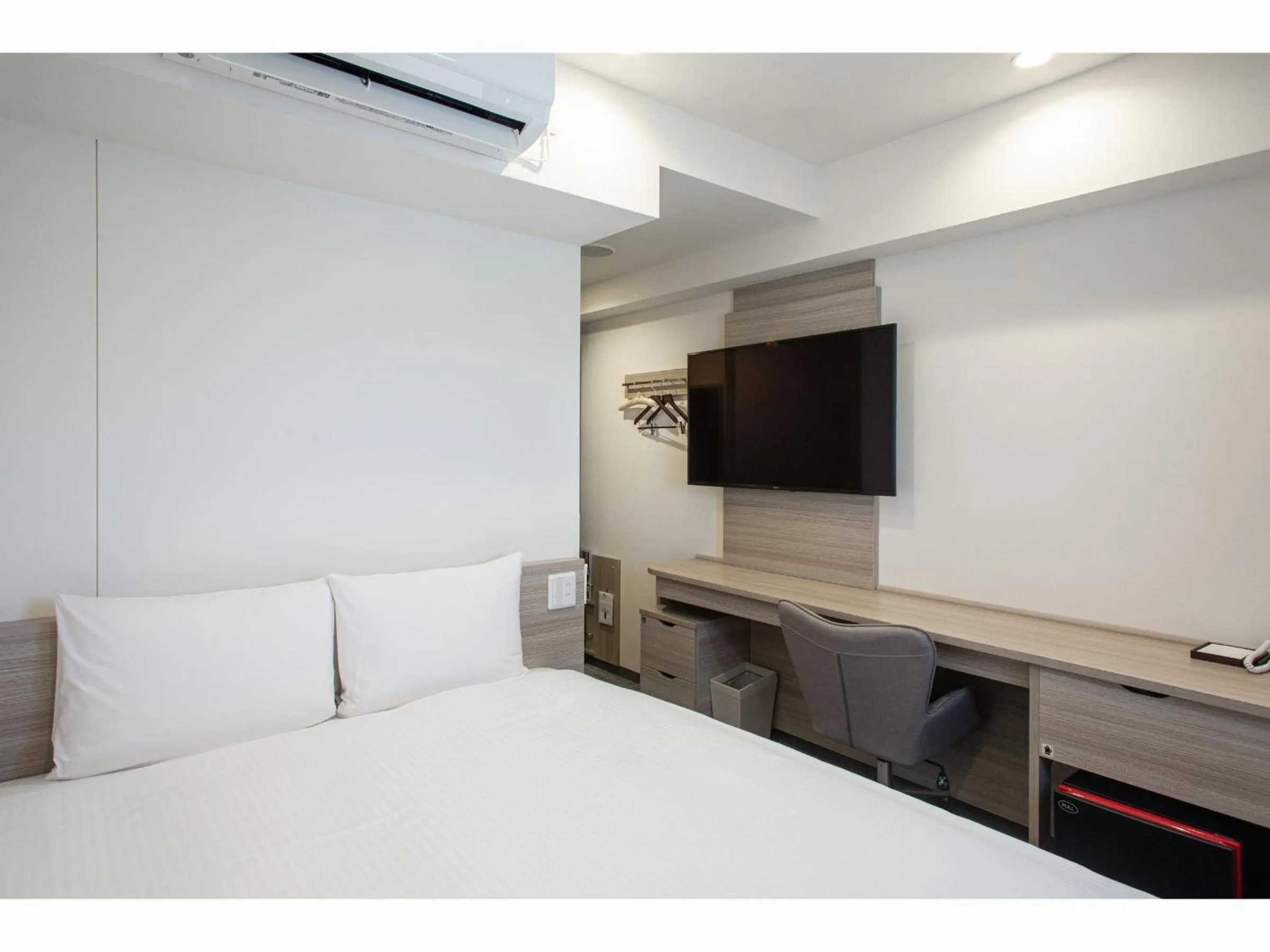 Bed in Kuretake Inn Premium Tajimi Ekimae