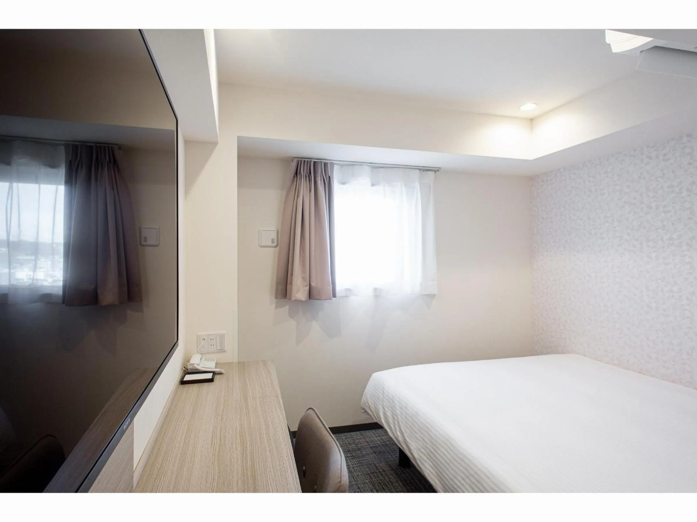 Bed in Kuretake Inn Premium Tajimi Ekimae