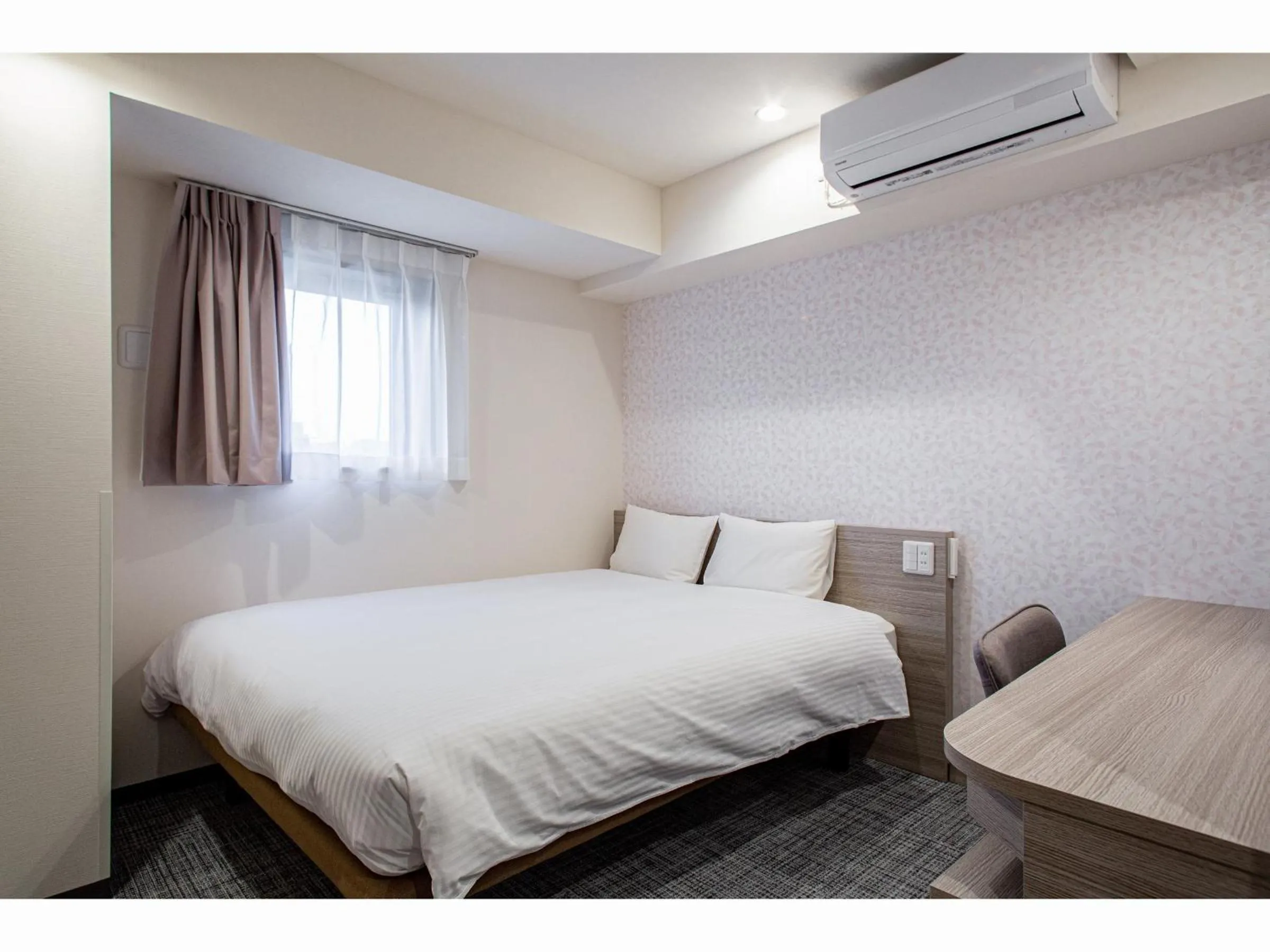 Bed in Kuretake Inn Premium Tajimi Ekimae