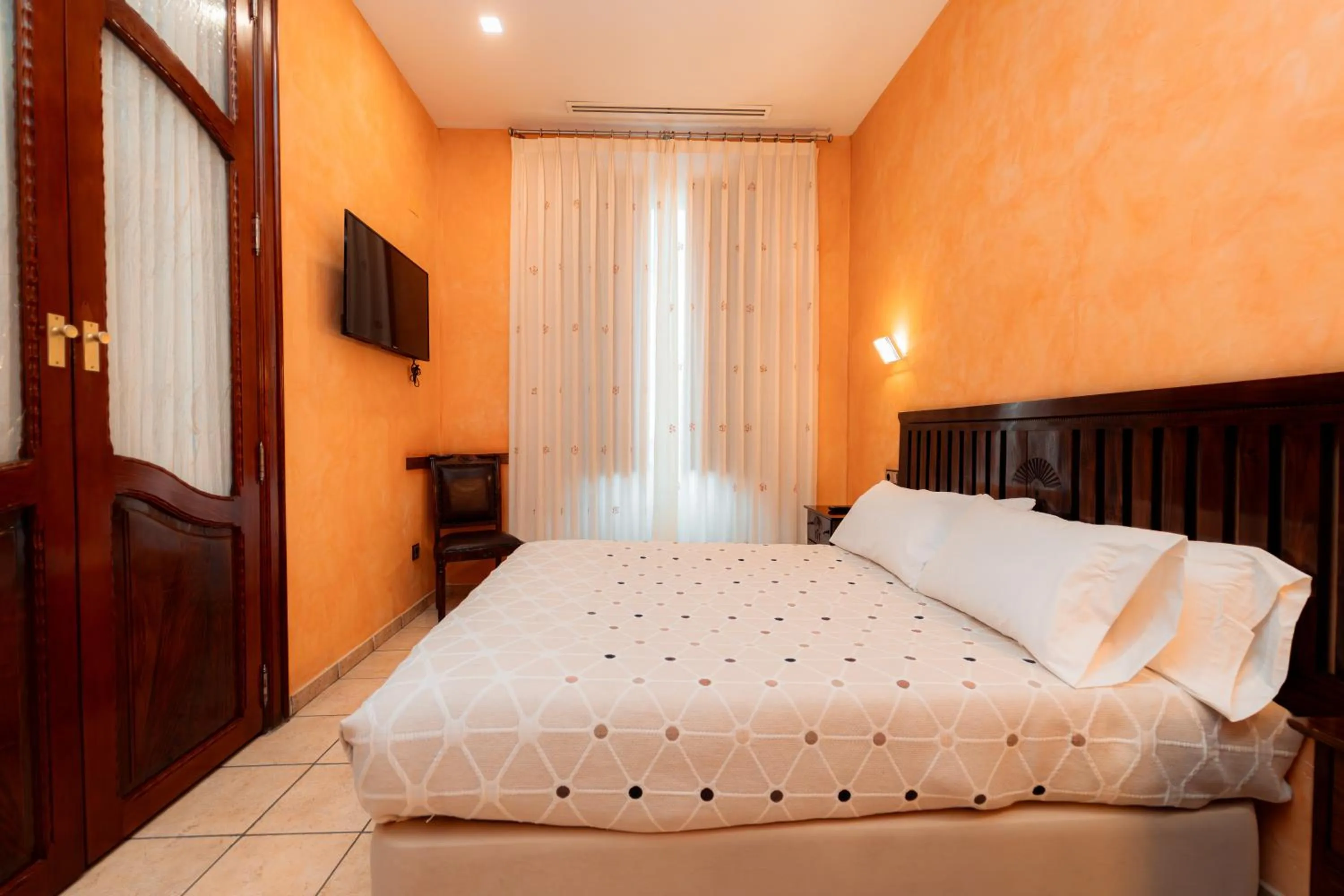 Bed in L'Agora Hotel