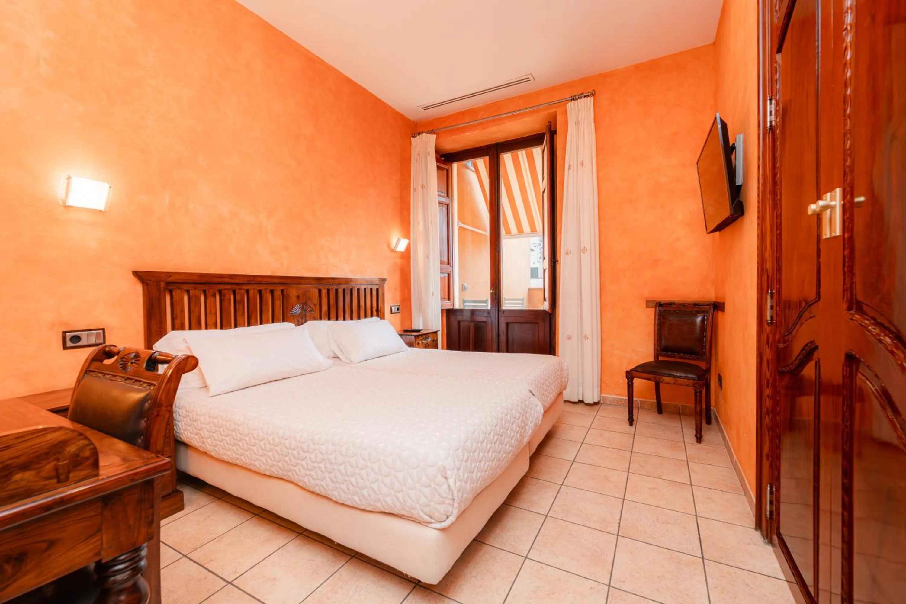 Bed in L'Agora Hotel