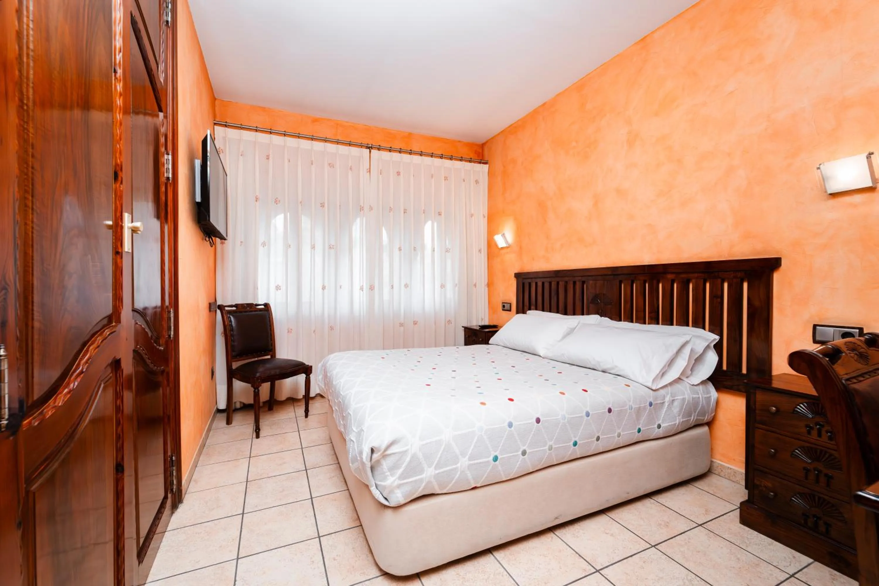 Bed in L'Agora Hotel