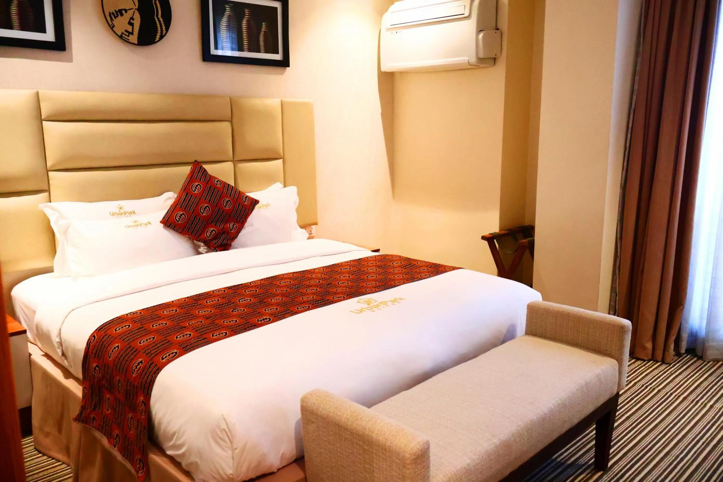 Bed in Urban Park Suites Hotel