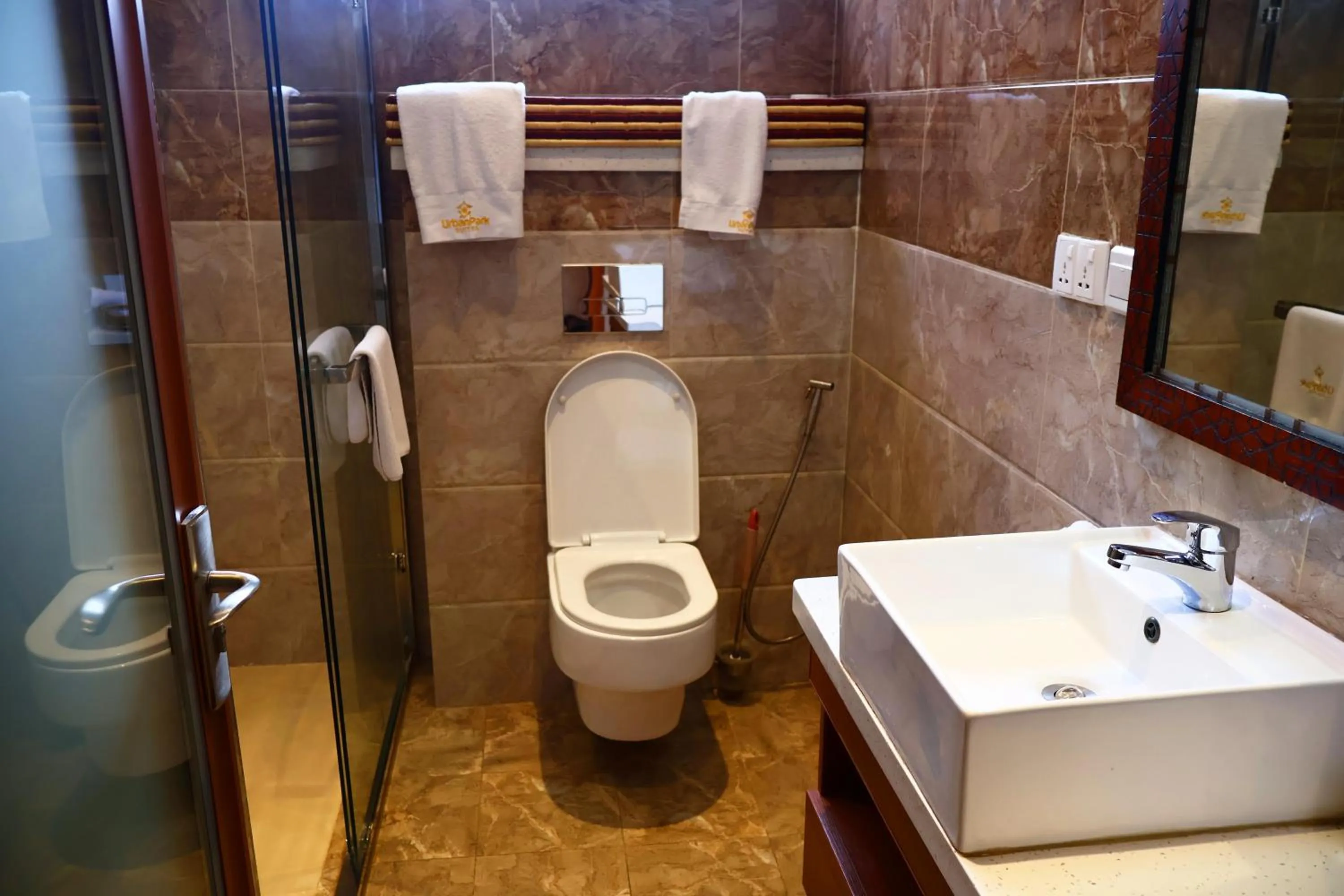 Toilet in Urban Park Suites Hotel