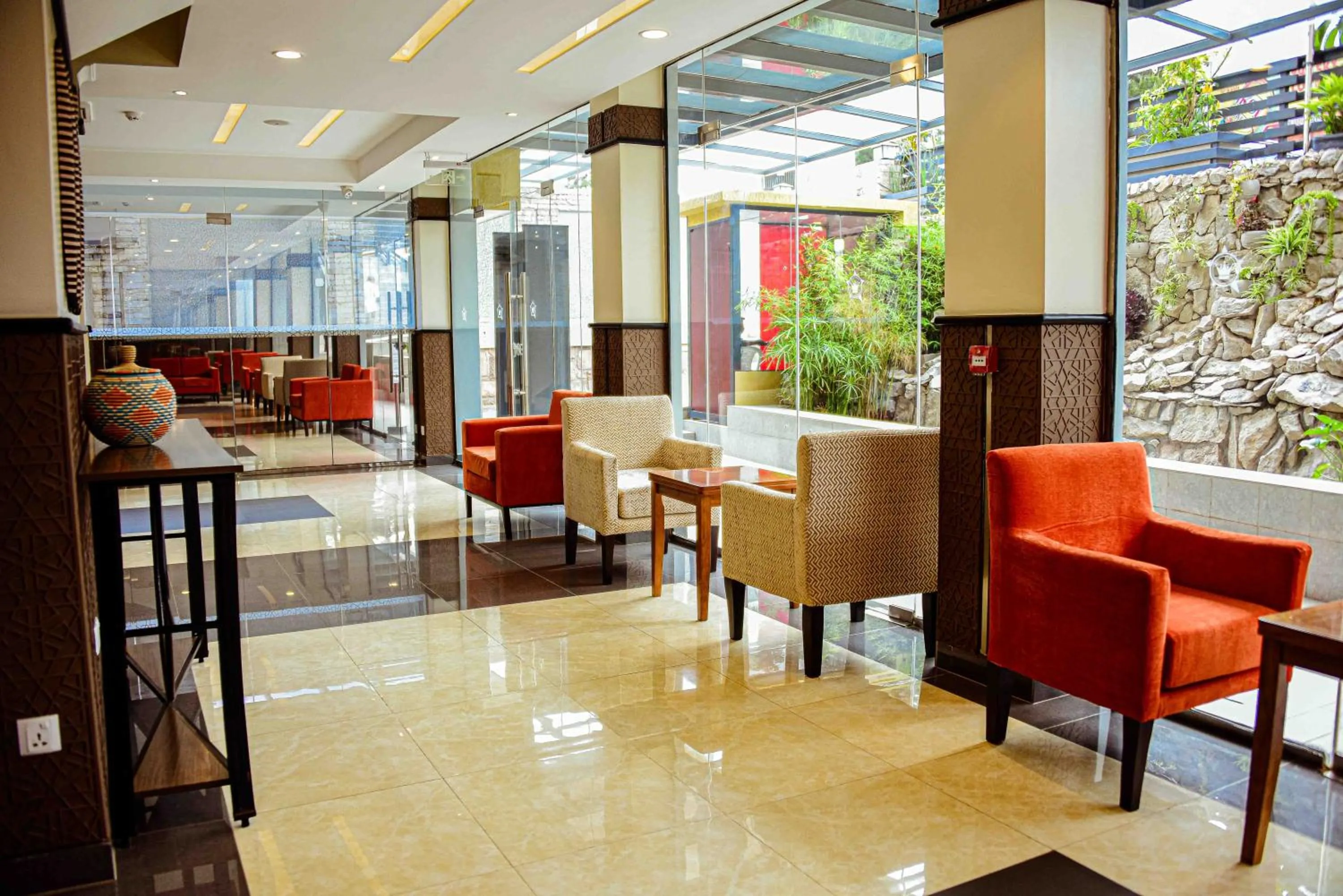 Communal lounge/ TV room in Urban Park Suites Hotel