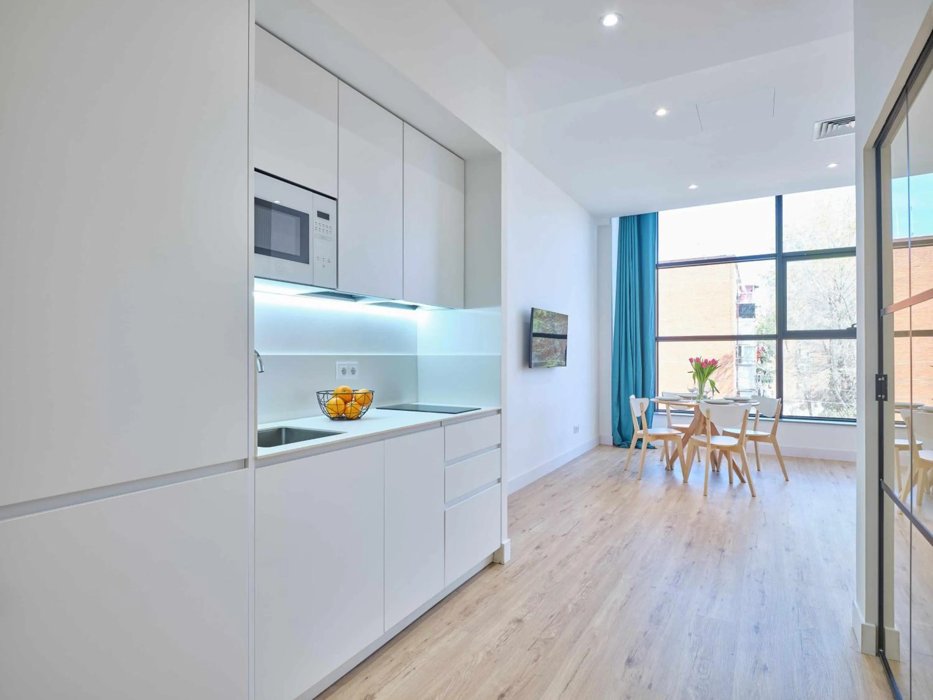 Kitchen or kitchenette in Paseo Suites Hotel