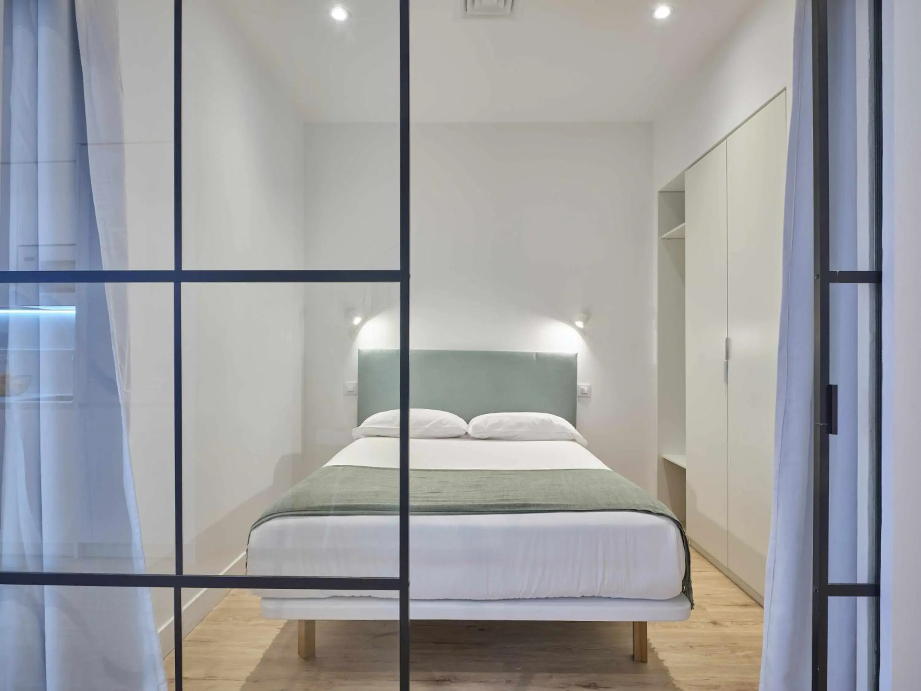 Bed in Paseo Suites Hotel Bed in Paseo Suites Hotel