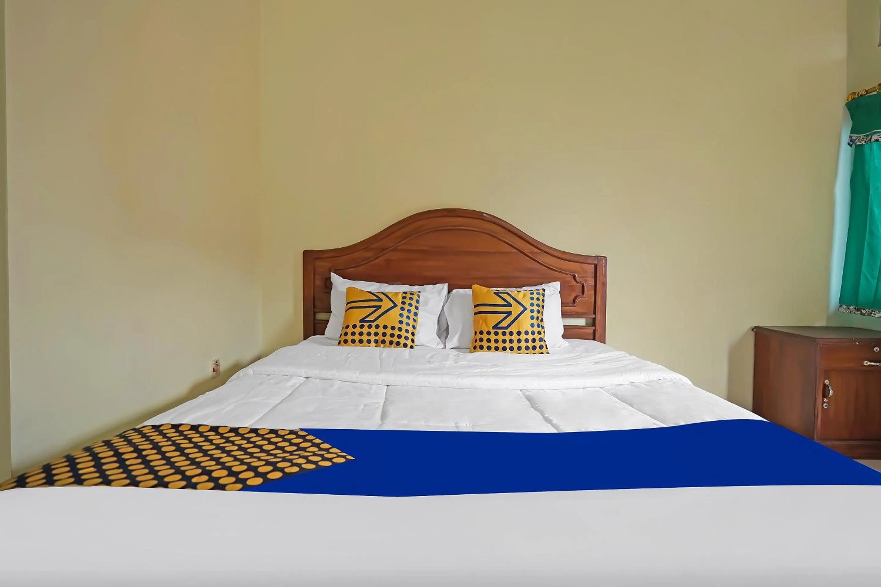 Bedroom in Hotel O Arfan HouseNearDanau Ranau