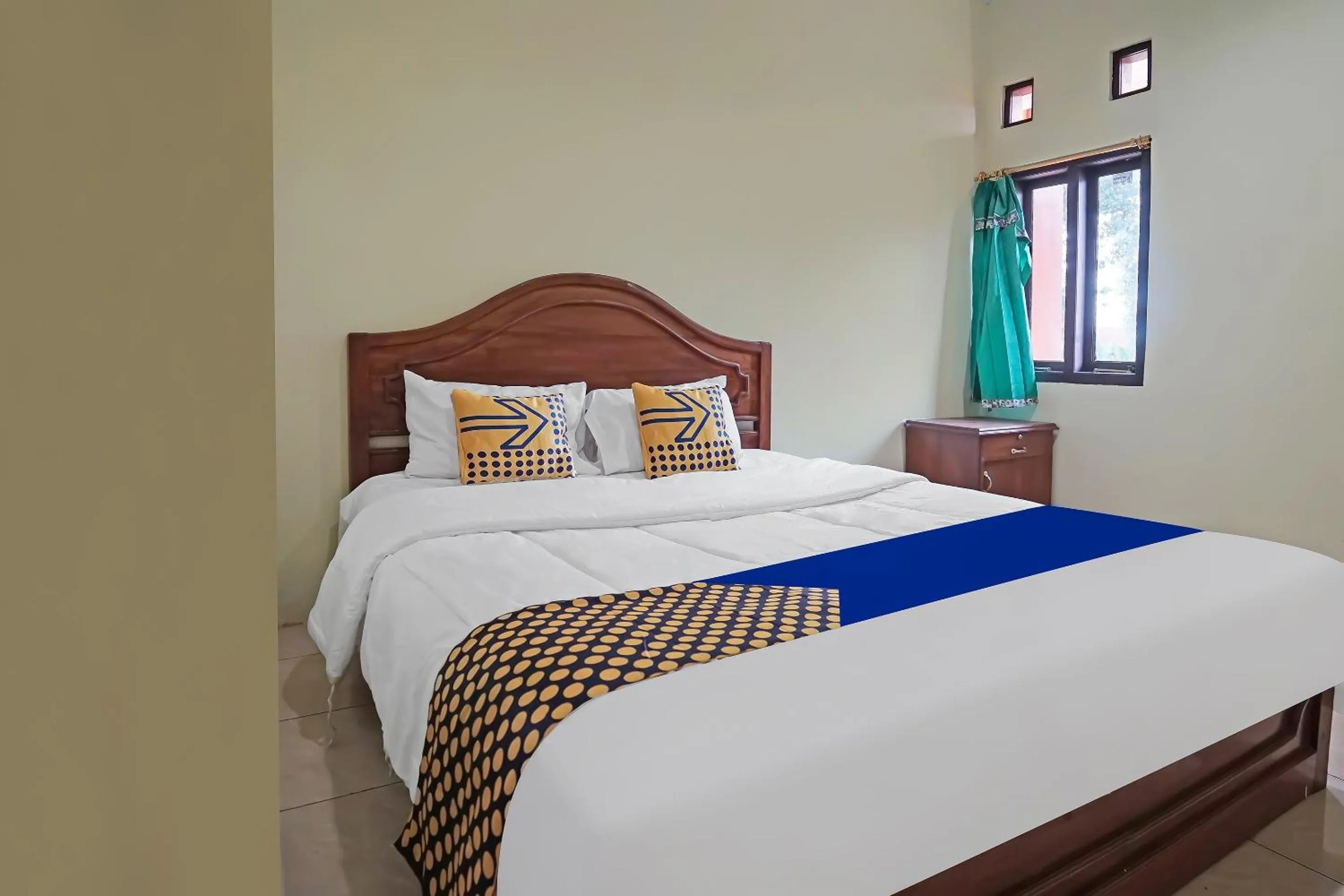 Bedroom in Hotel O Arfan HouseNearDanau Ranau