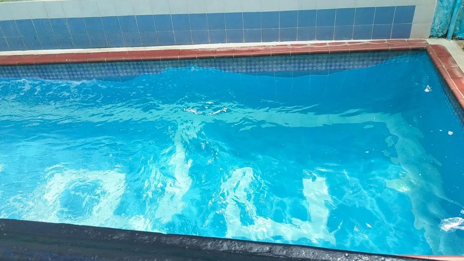 Swimming pool in Hotel Plaza Confort Inn