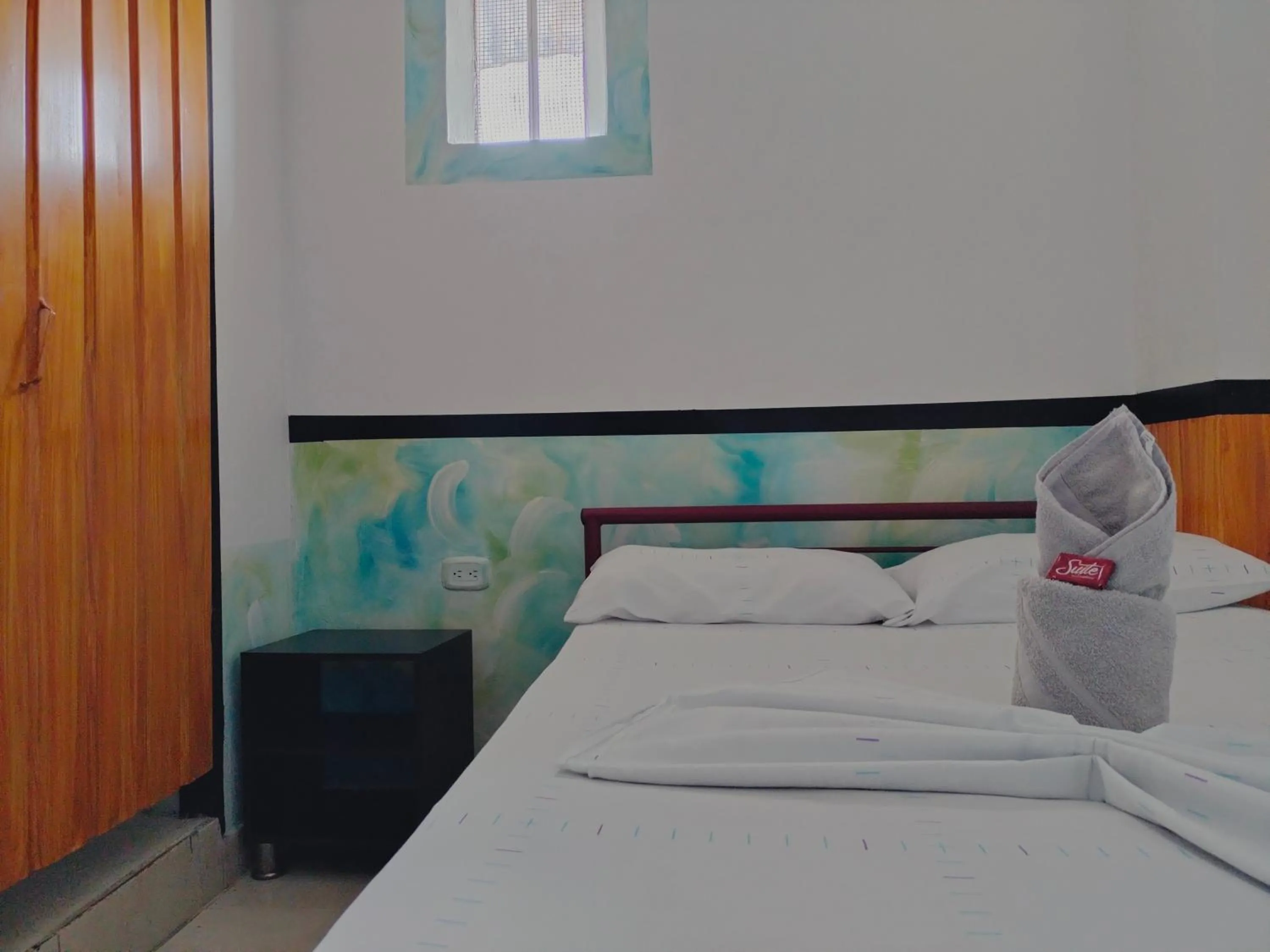 Bed in Hotel Plaza Confort Inn