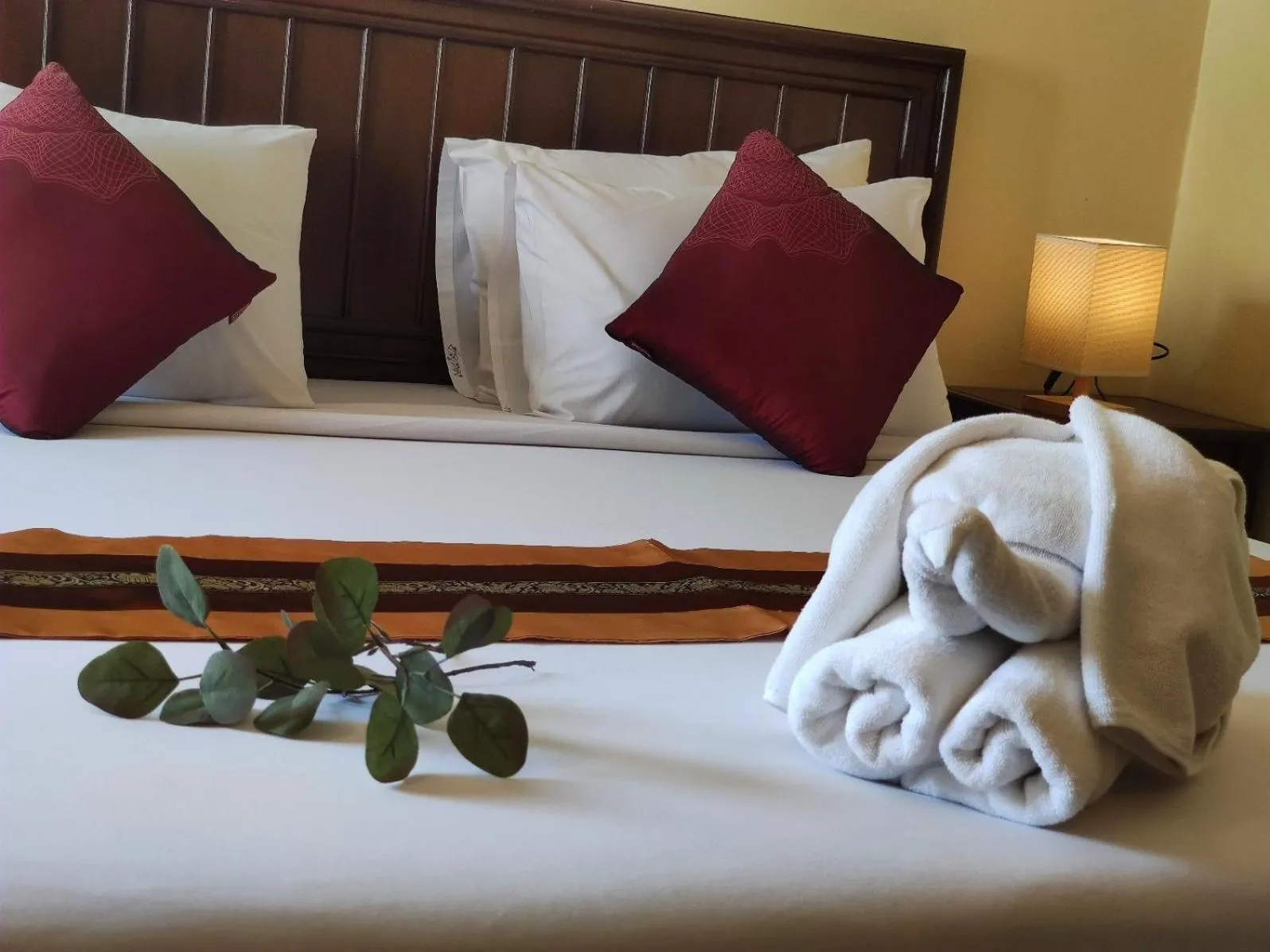 Bed in The Chanthong Residence and Hotel Pattaya