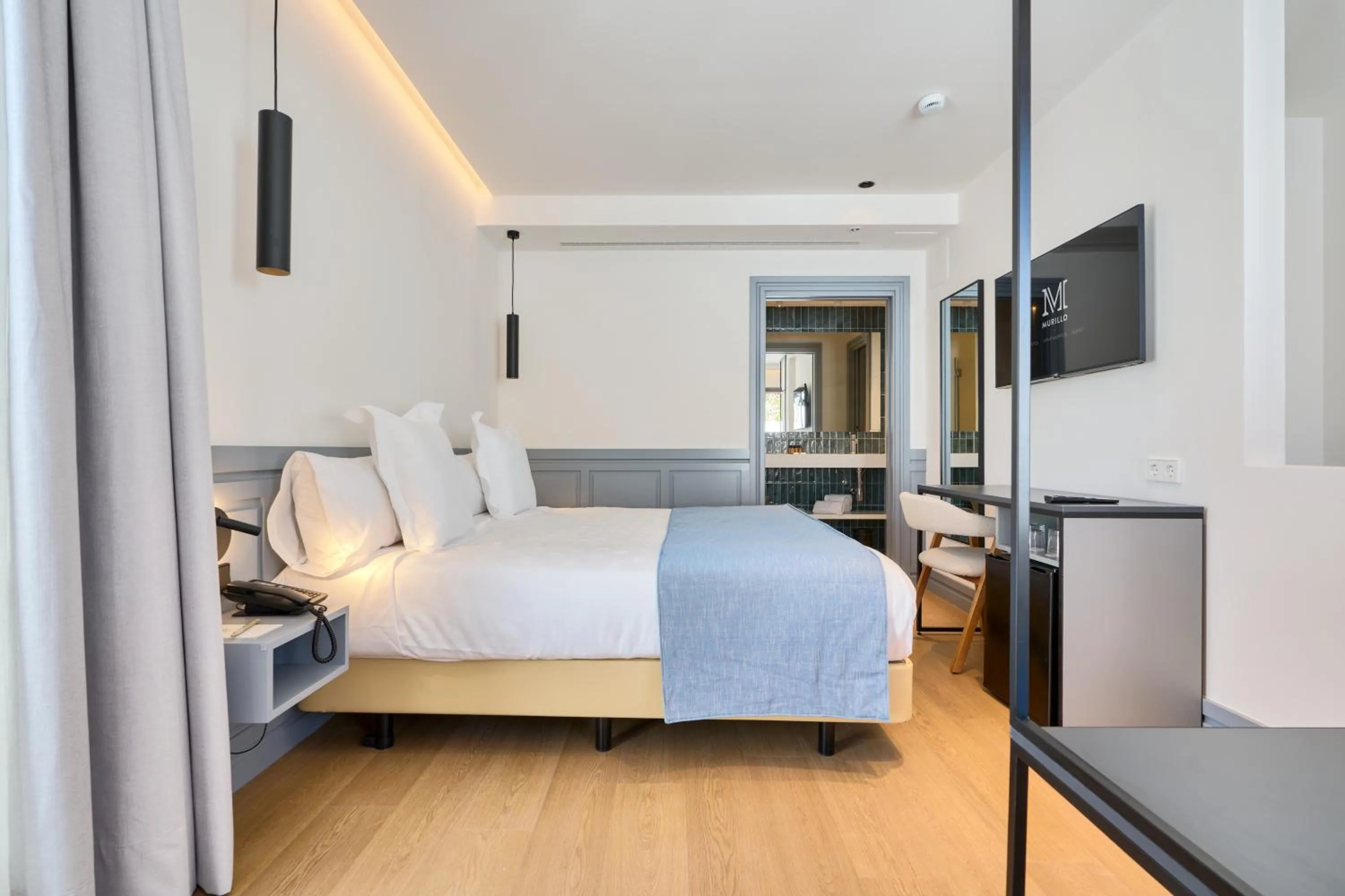 Bed in Hotel Murillo Reinoso