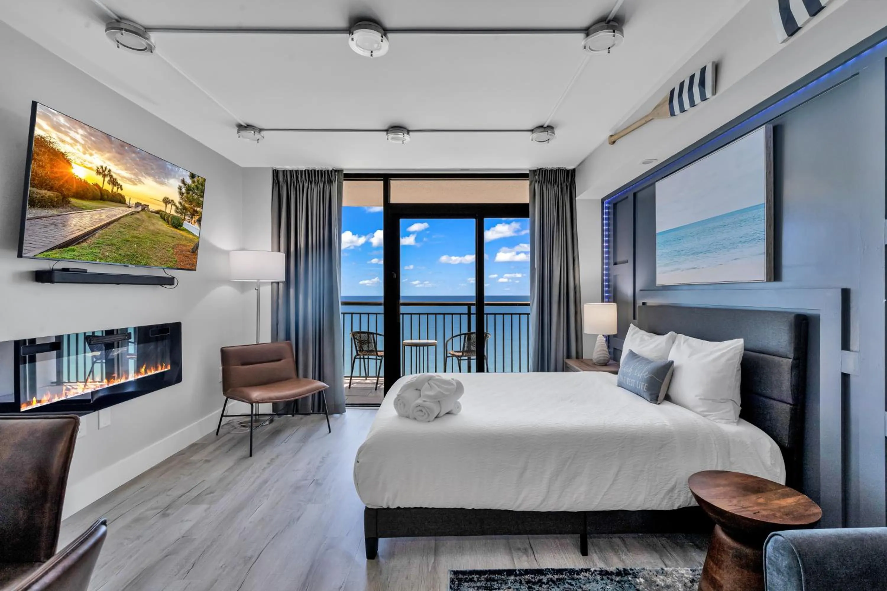 Living room, Bed in Breakers Tower 1BR Oceanfront Condo