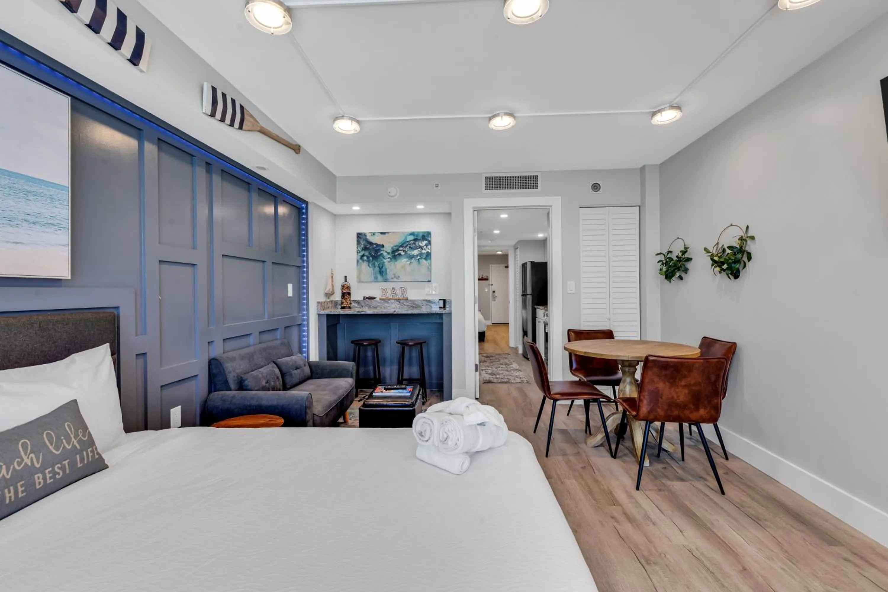 Living room, Bed in Breakers Tower 1BR Oceanfront Condo