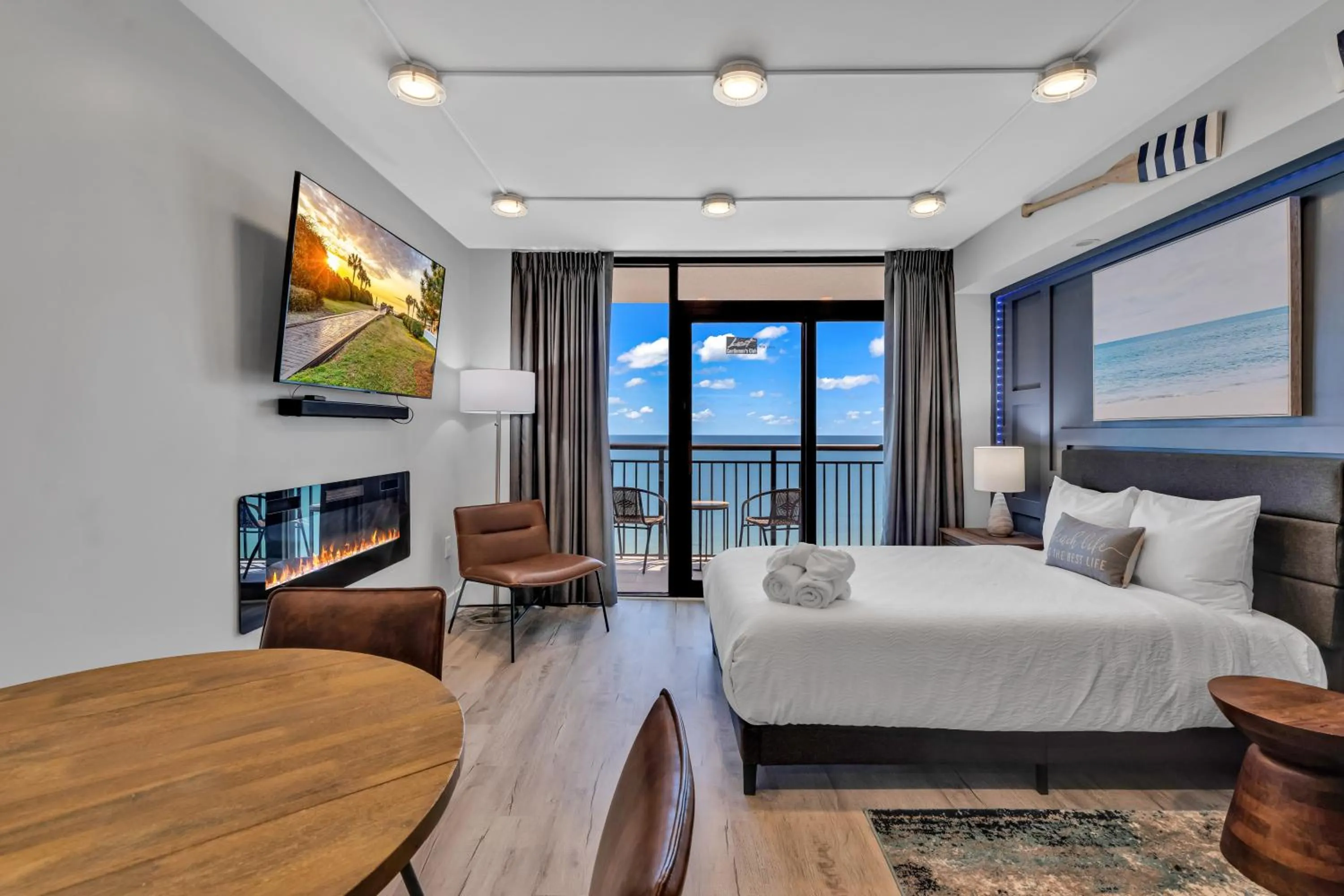 Living room, Bed in Breakers Tower 1BR Oceanfront Condo