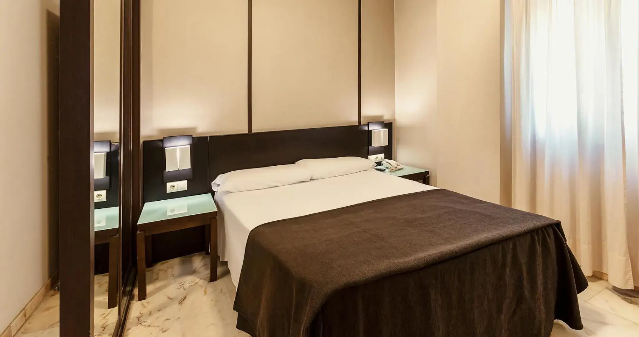 Bedroom, Bed in Apartamentos Vértice Bib Rambla Bedroom, Bed in Apartamentos Vértice Bib Rambla