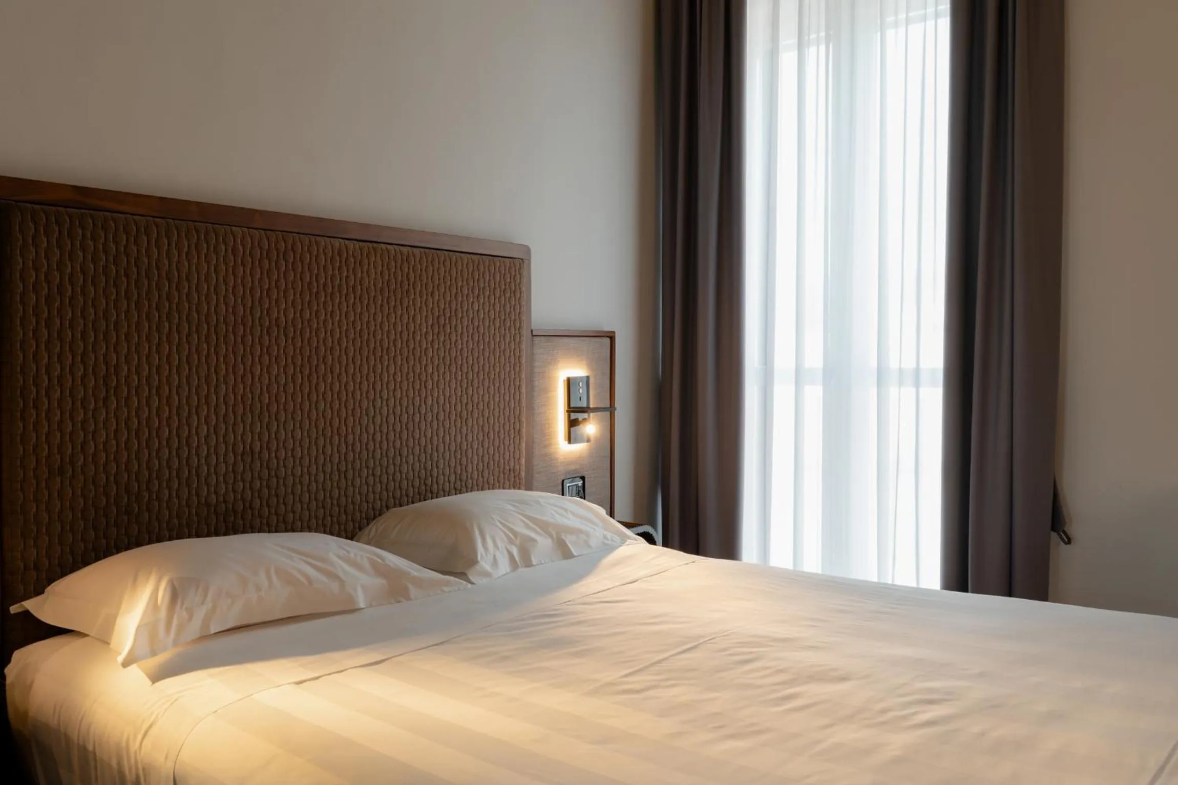 Bed in Lo Stemma Luxury Boutique Hotel