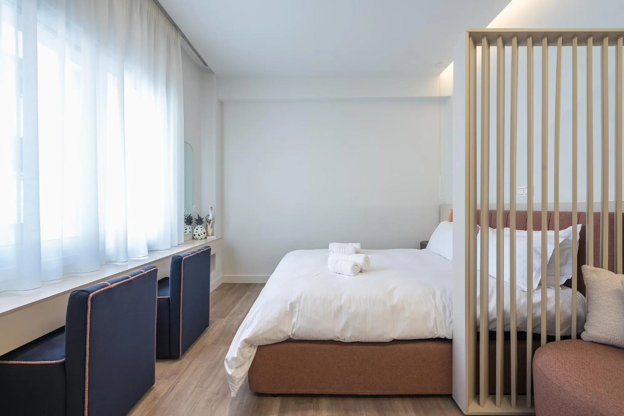 Bed in Aeiphoria Suites & Rooms - Athens