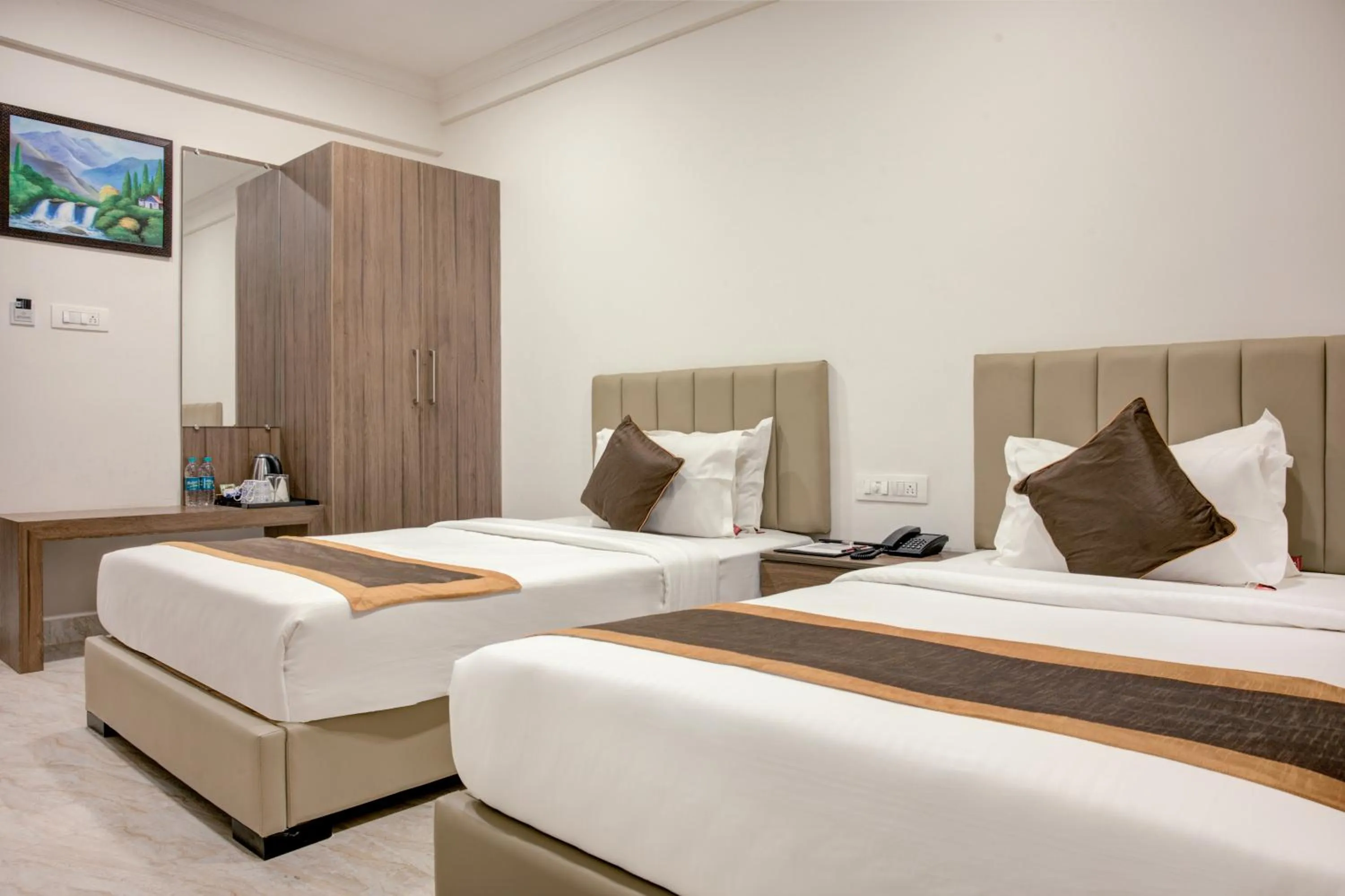 Photo of the whole room, Bed in Hotel Sterling Inn Bangalore International Airport