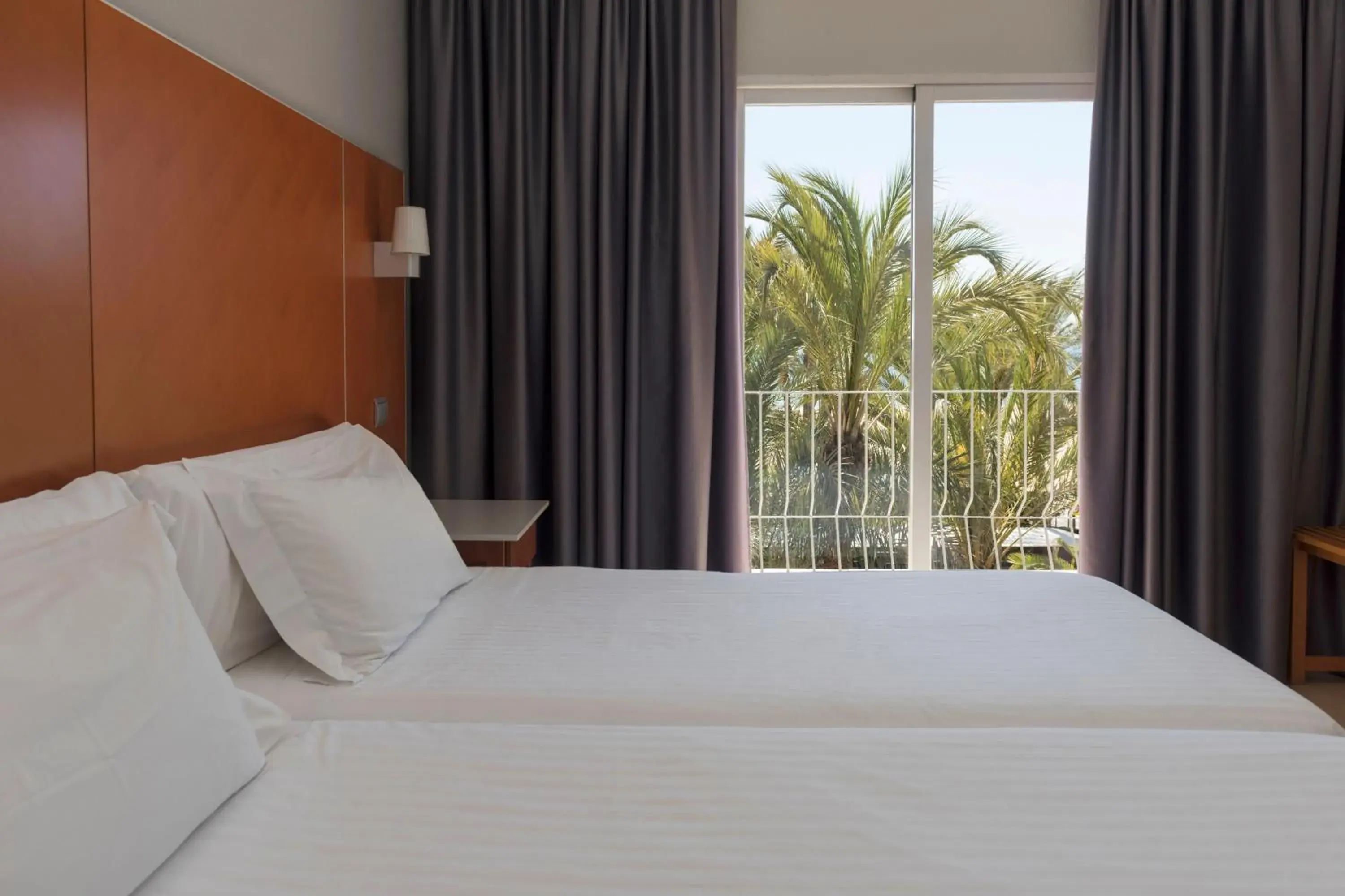 Bedroom, Bed in Hotel El Palmeral Bedroom, Bed in Hotel El Palmeral