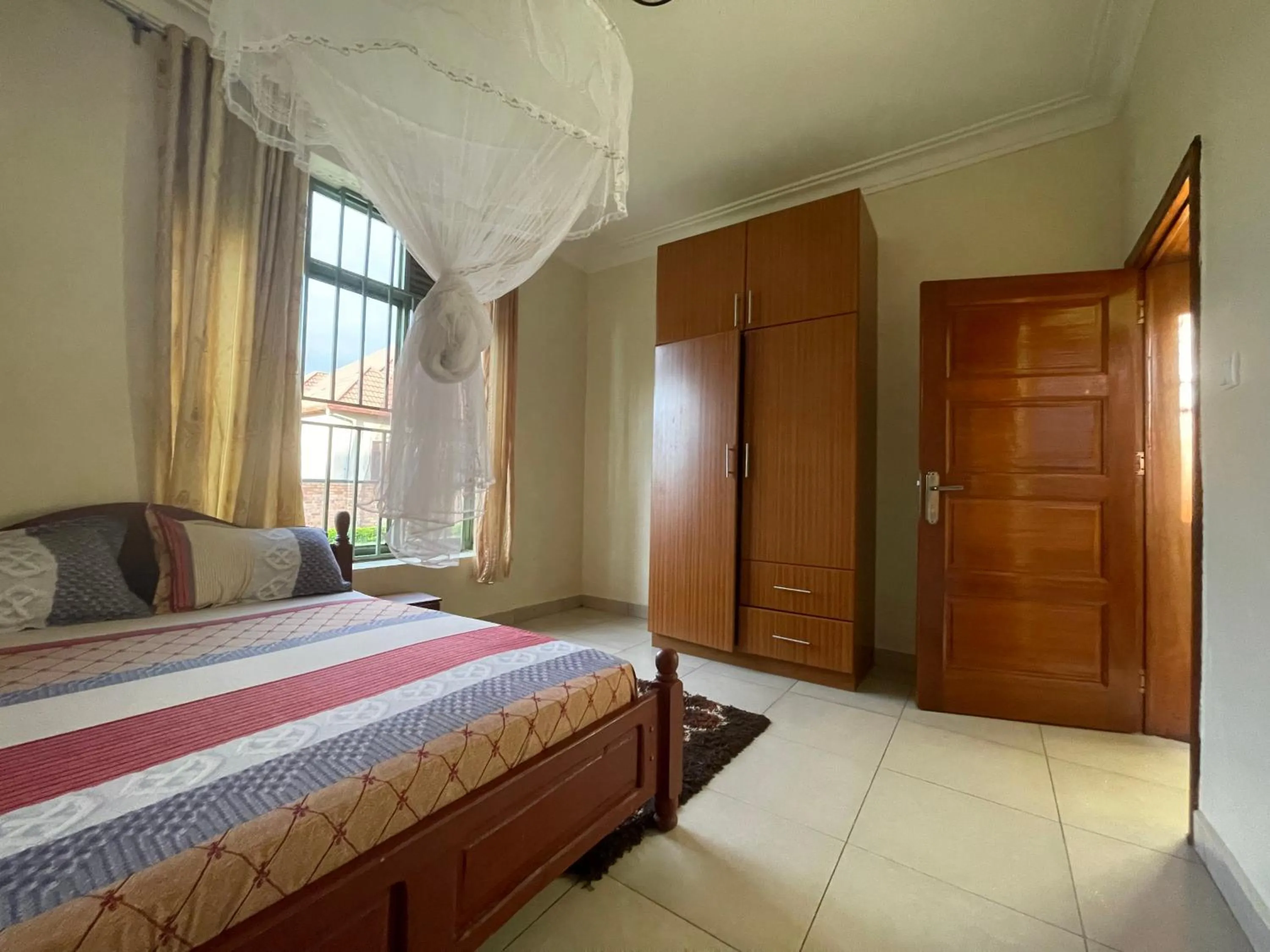 Photo of the whole room, Bed in Captivating 7-Bed House in Kigali Rwanda