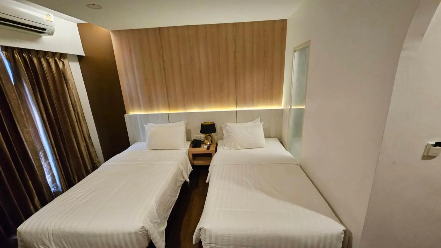 Bed in M CASA HOTEL PATTAYA