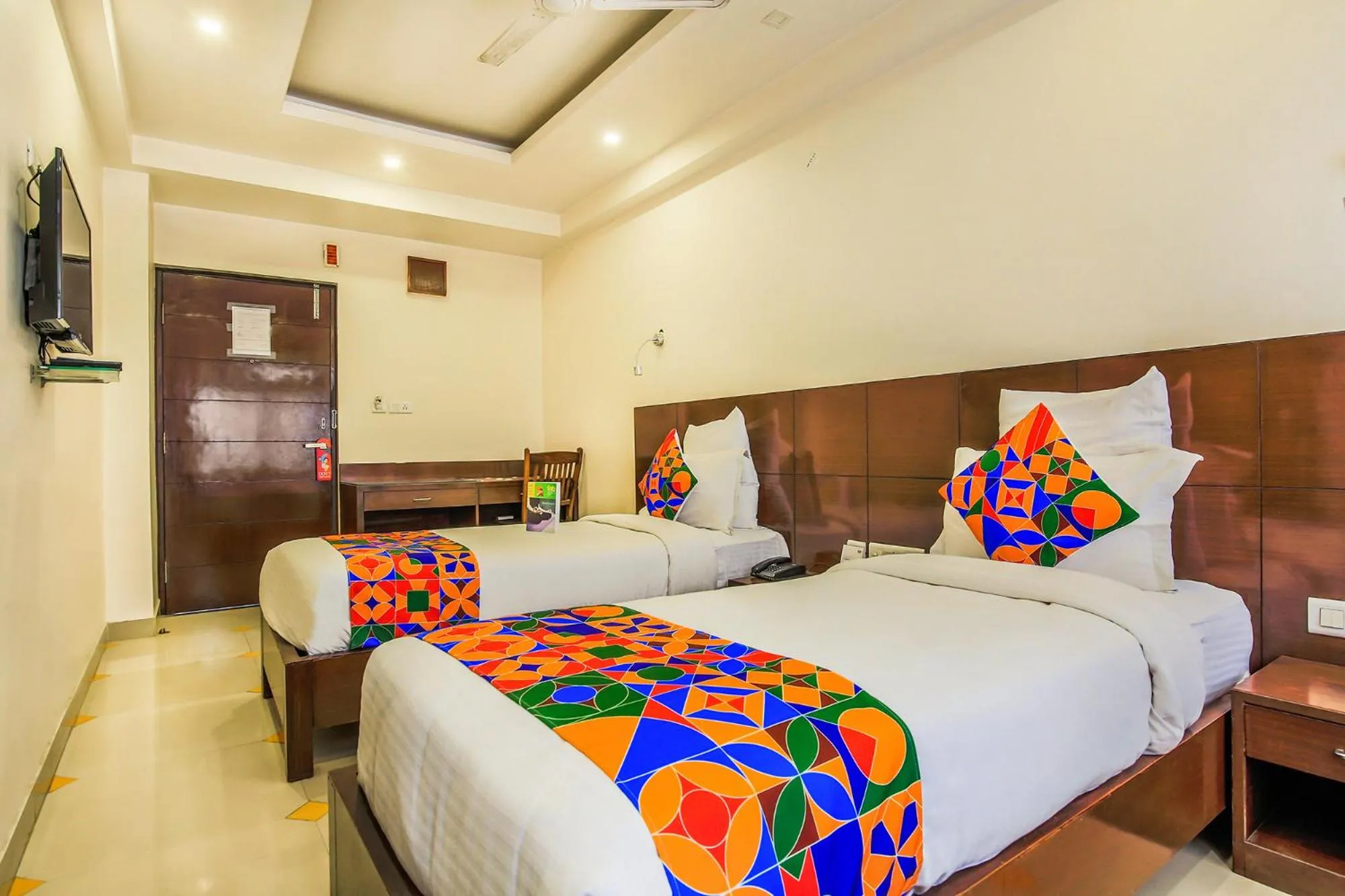 Bed in FabHotel Tipsyy Inn Suites