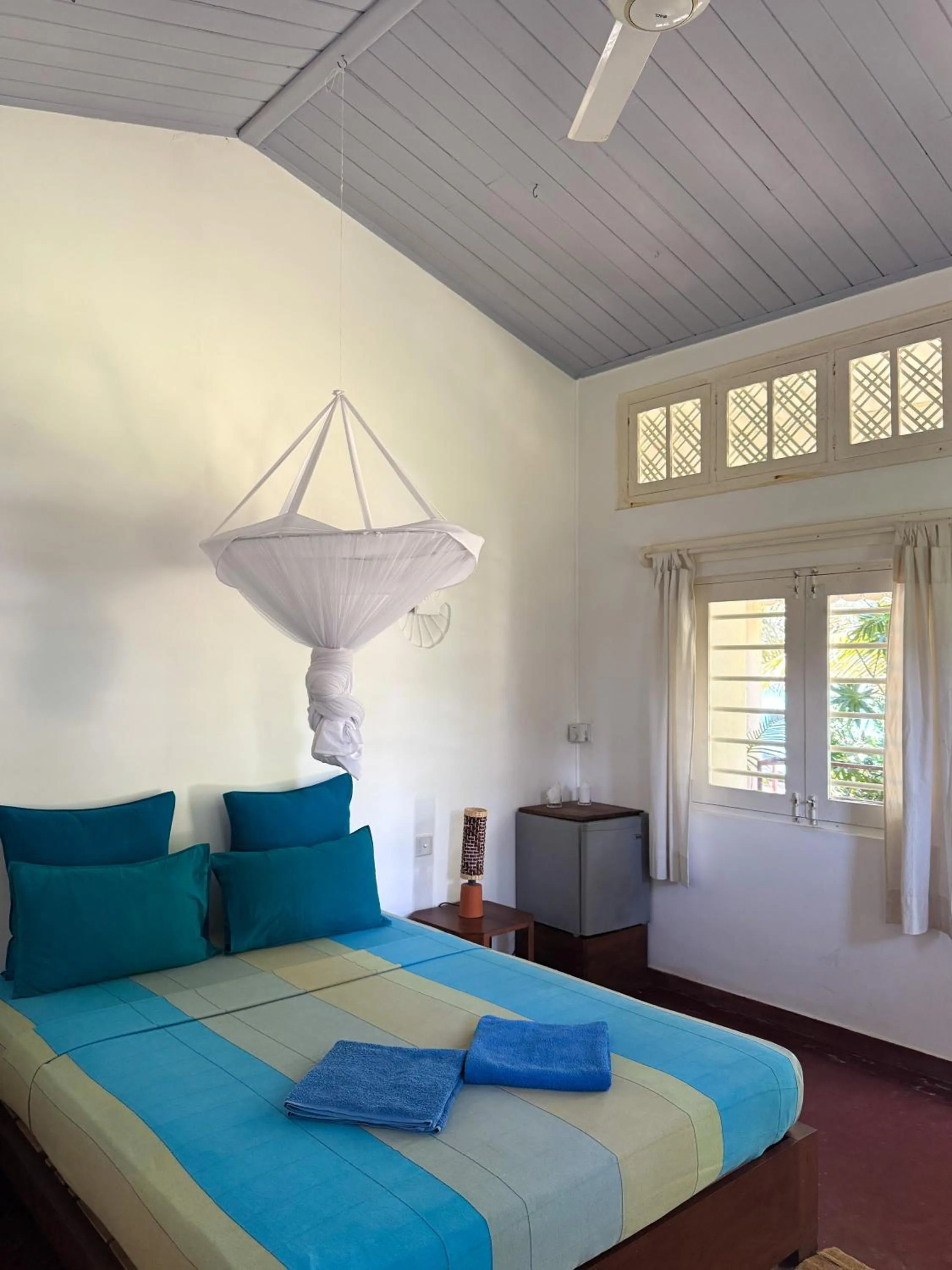 Bed in Palm villa Mirissa hotel&spa