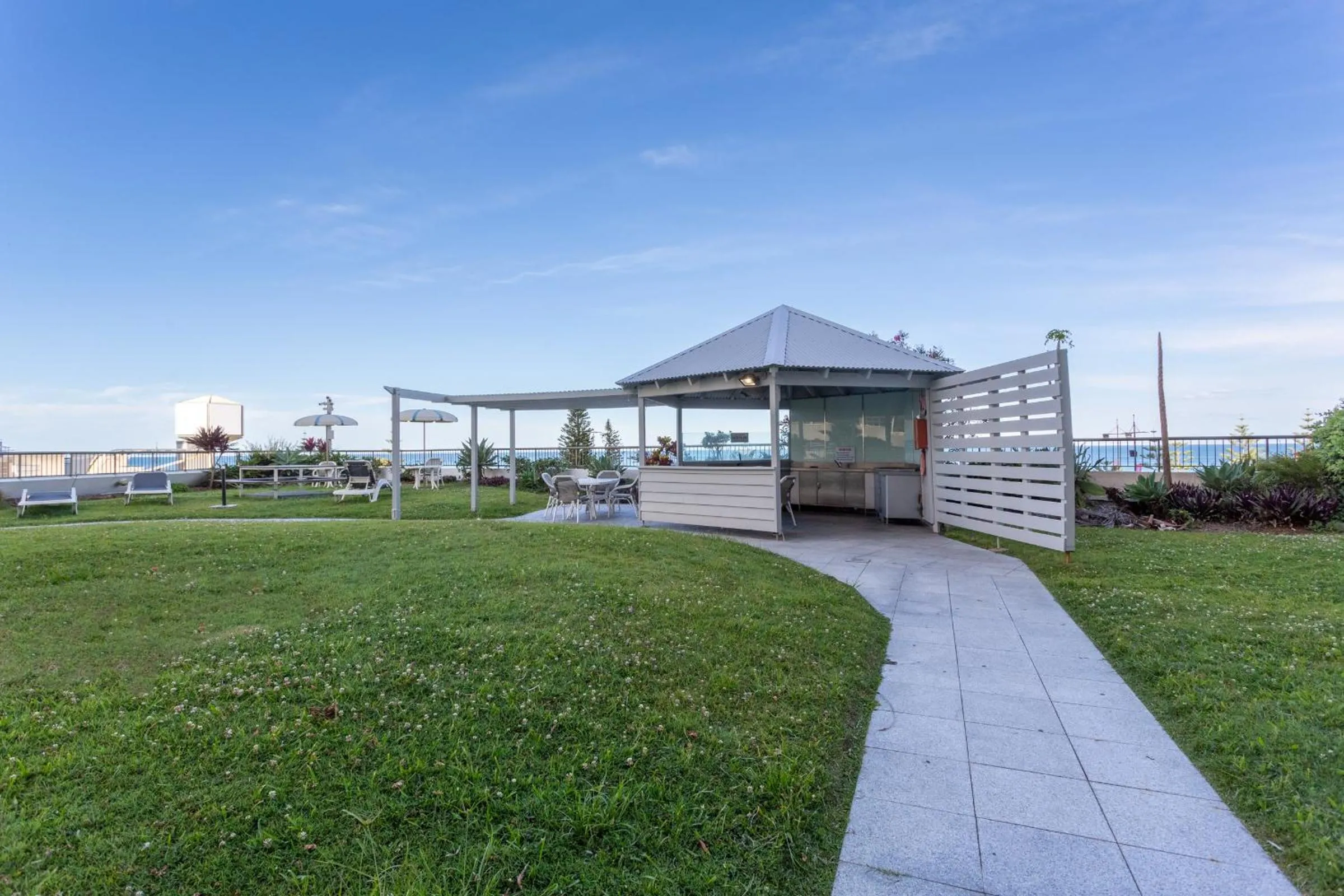 Patio in Oceanfront Family Apartment Pool & BBQ