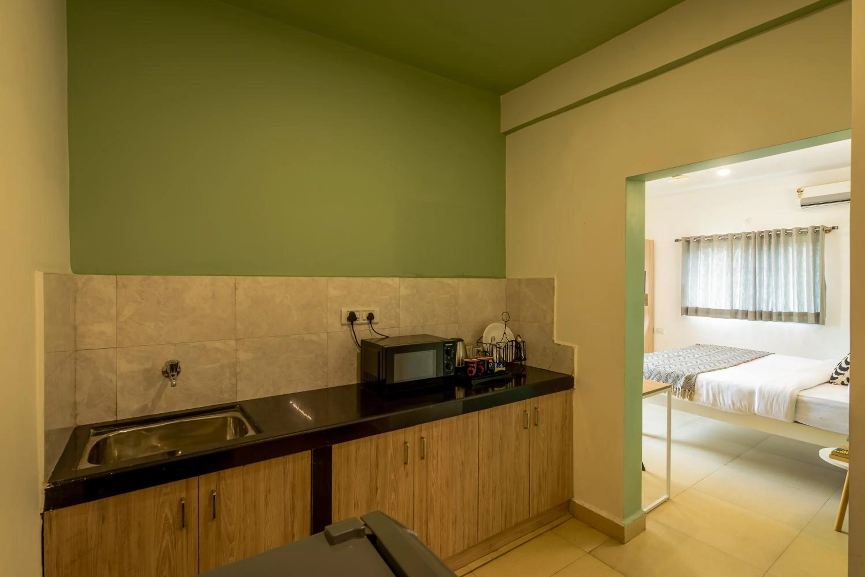 kitchen, Bed in Olive Hotel Calangute Niwasa by Embassy Group