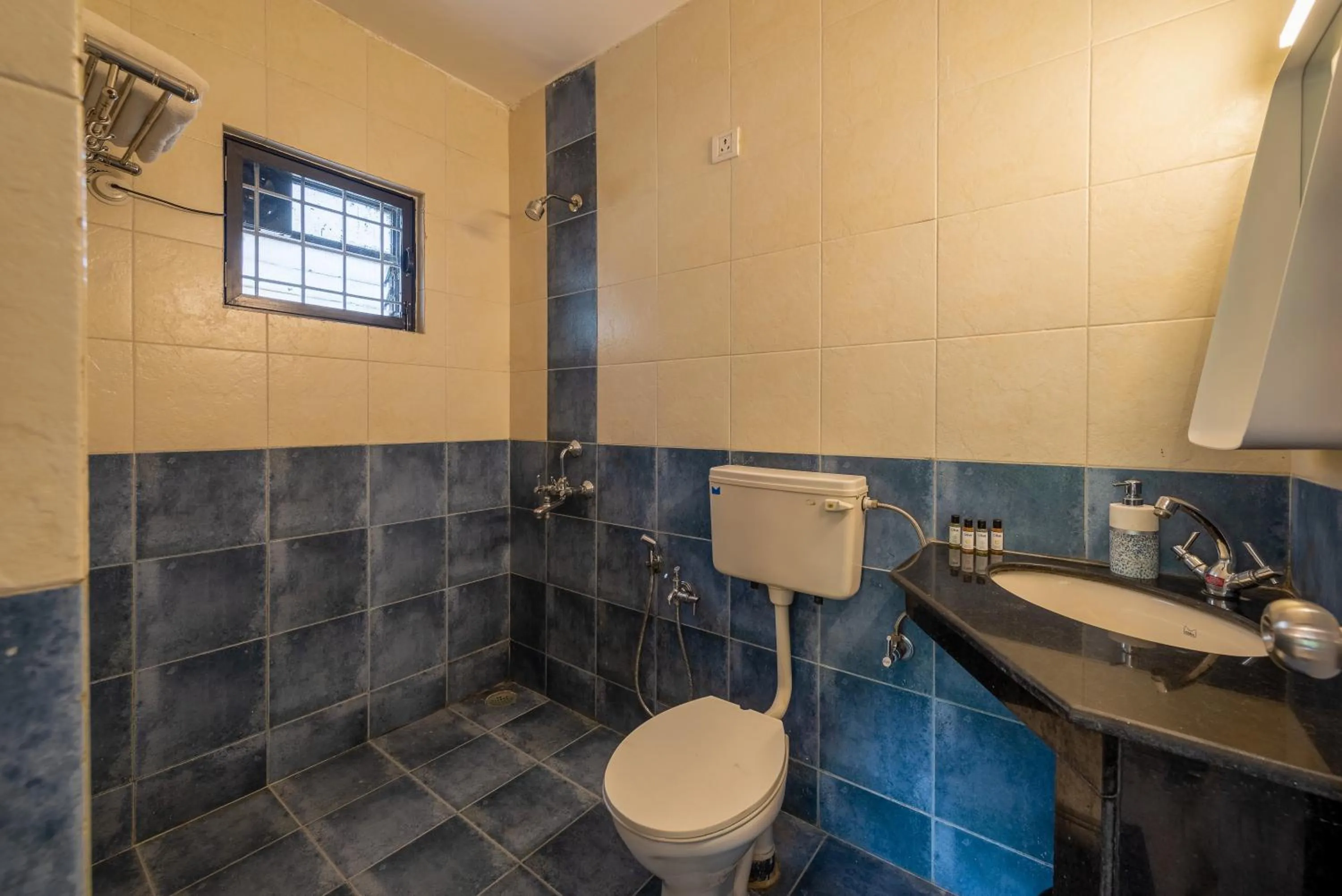 Toilet in Olive Hotel Calangute Niwasa by Embassy Group