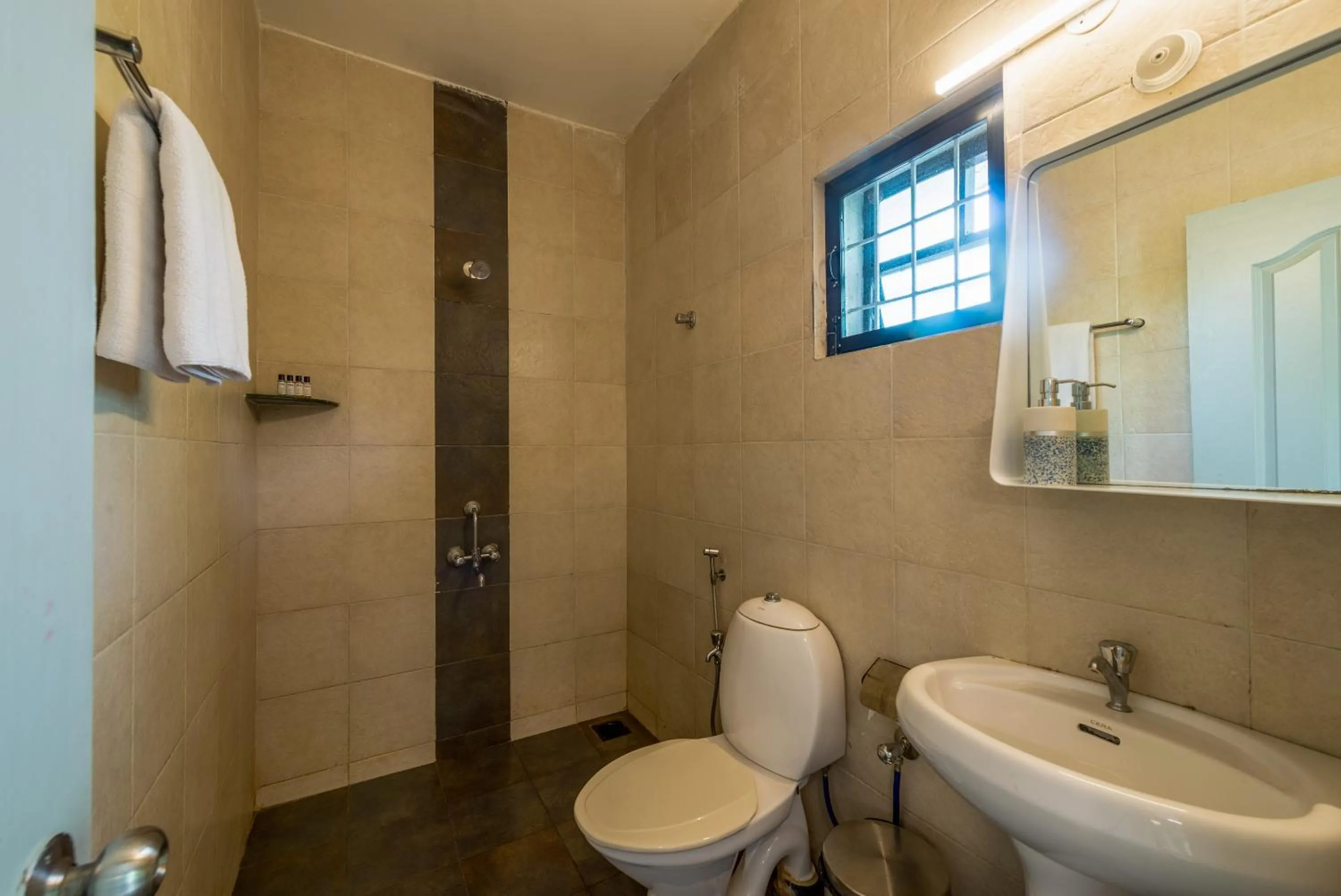 Toilet in Olive Hotel Calangute Niwasa by Embassy Group