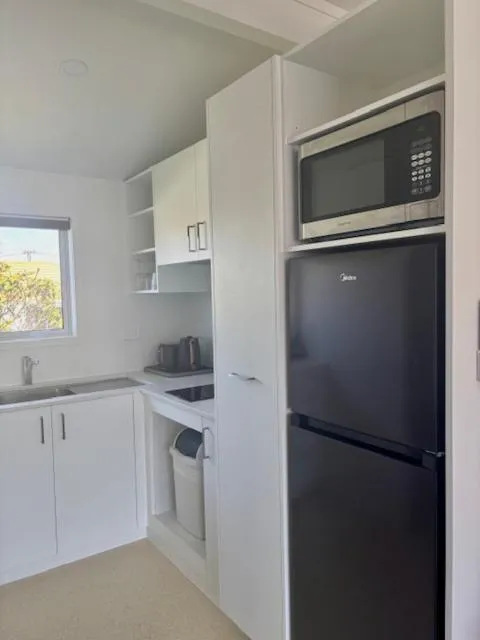 Kitchen or kitchenette in Parkside Motel and Apartments