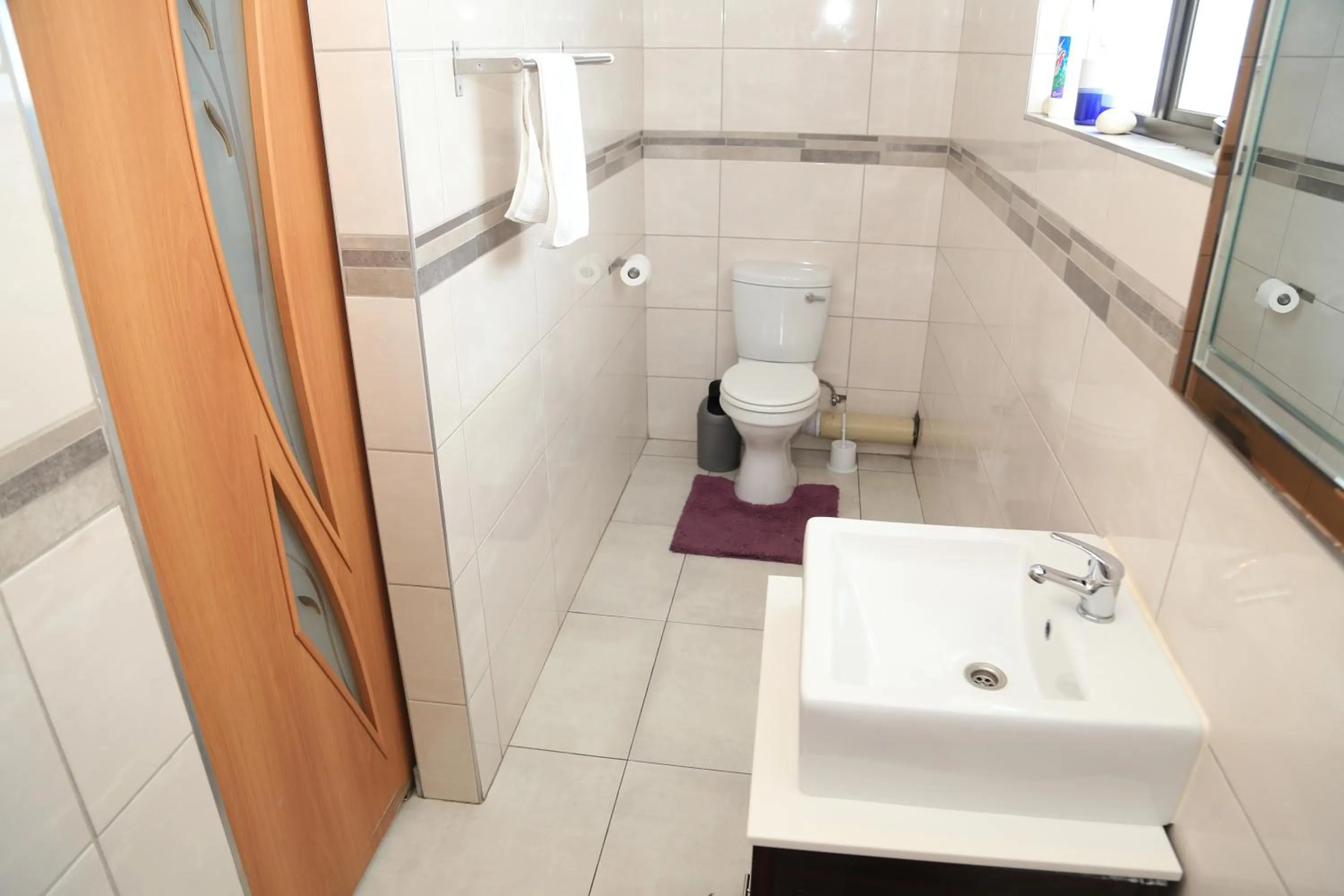 Toilet in Coco Palm Bed & Breakfast