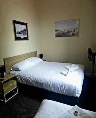 Bed in Family Hotel