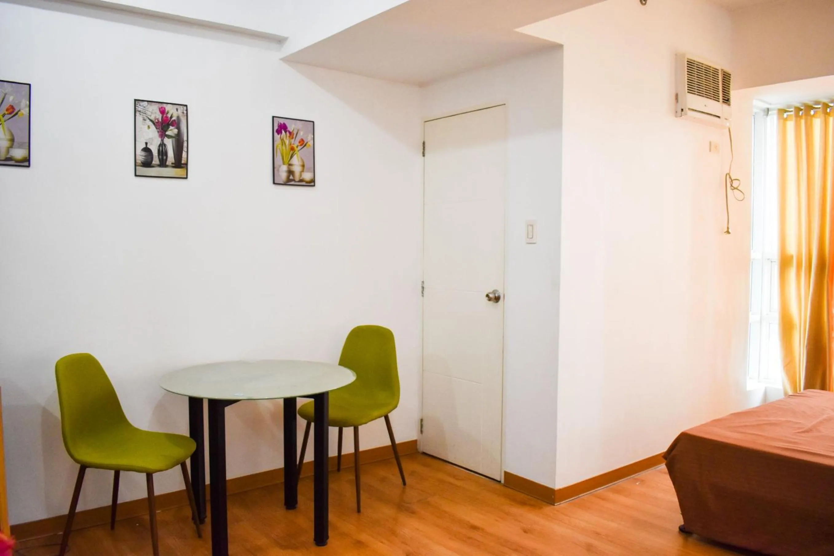 Seating area, Bed in The Boni Tower by RSPL Manila City Center