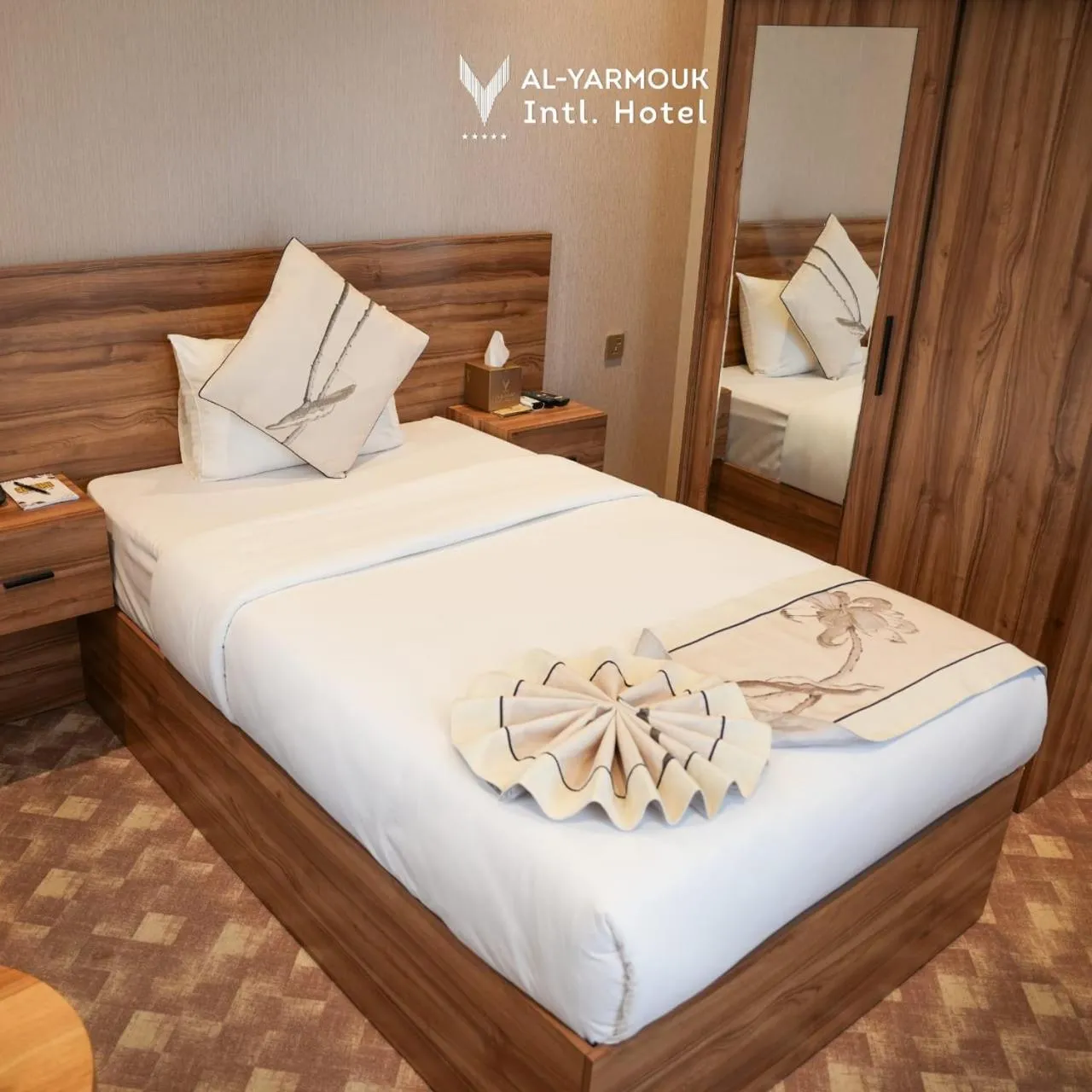 Bed in Al Yarmouk International Hotel