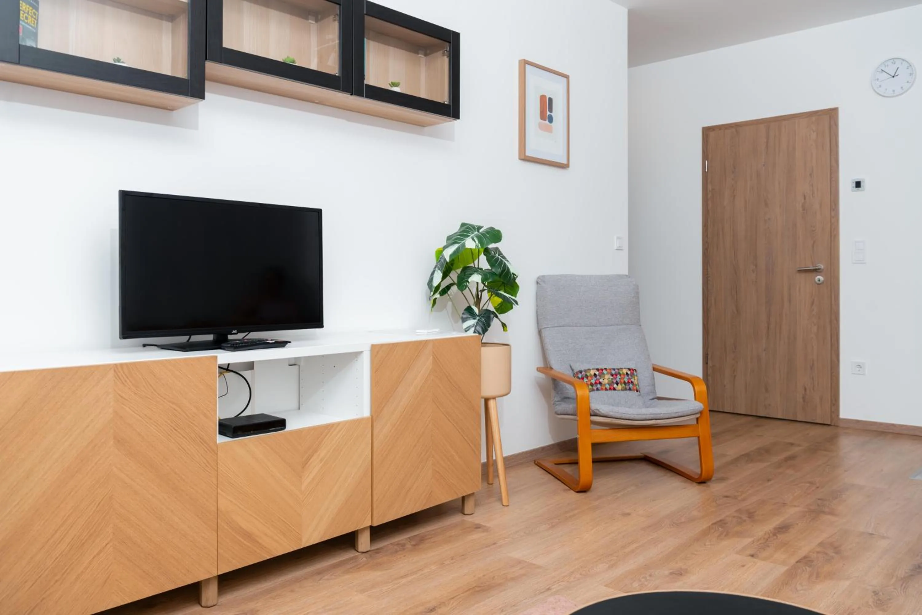 Communal lounge/ TV room in WestSide Apartments by FirstHost