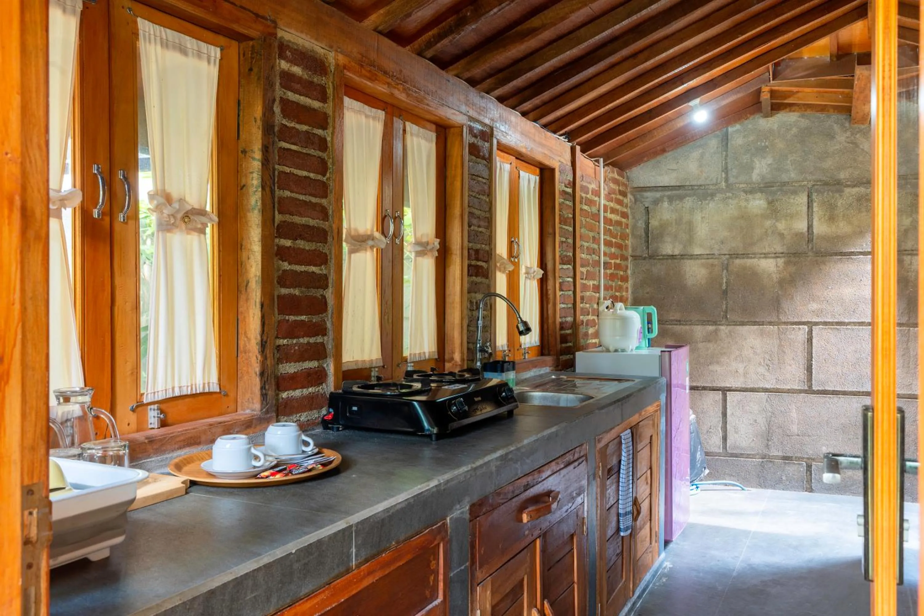 Kitchen or kitchenette in Tahlia's Villa