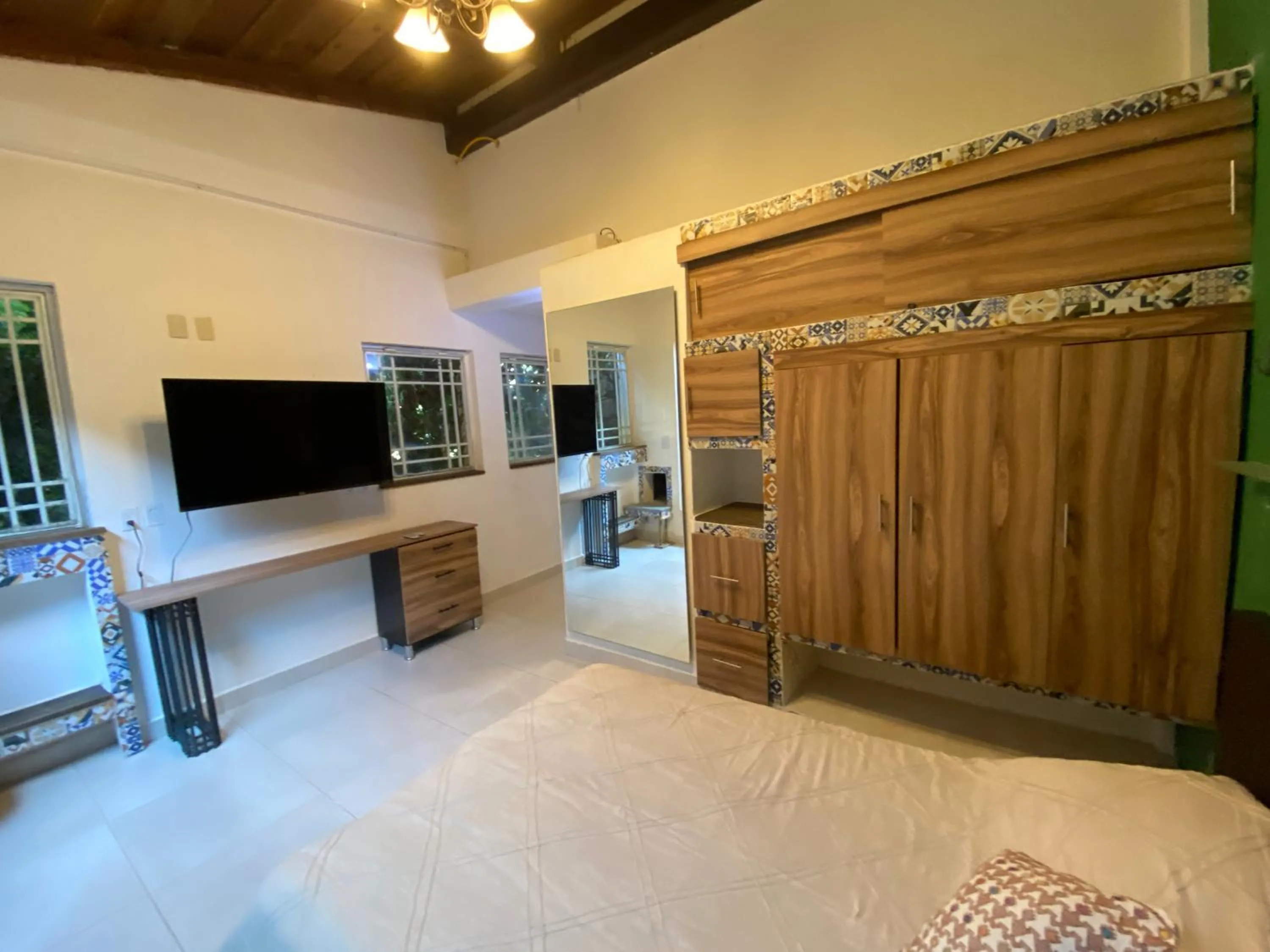 Communal lounge/ TV room, Bed in Magnolias Jardin & Boutique Suites