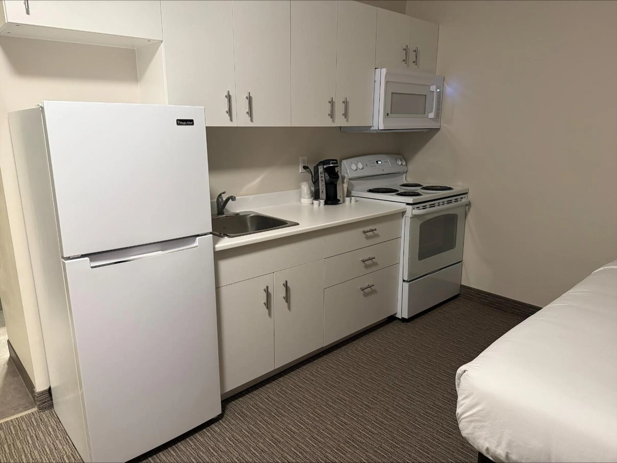 Kitchen or kitchenette in Anavada Inn & Suites - Grande Prairie